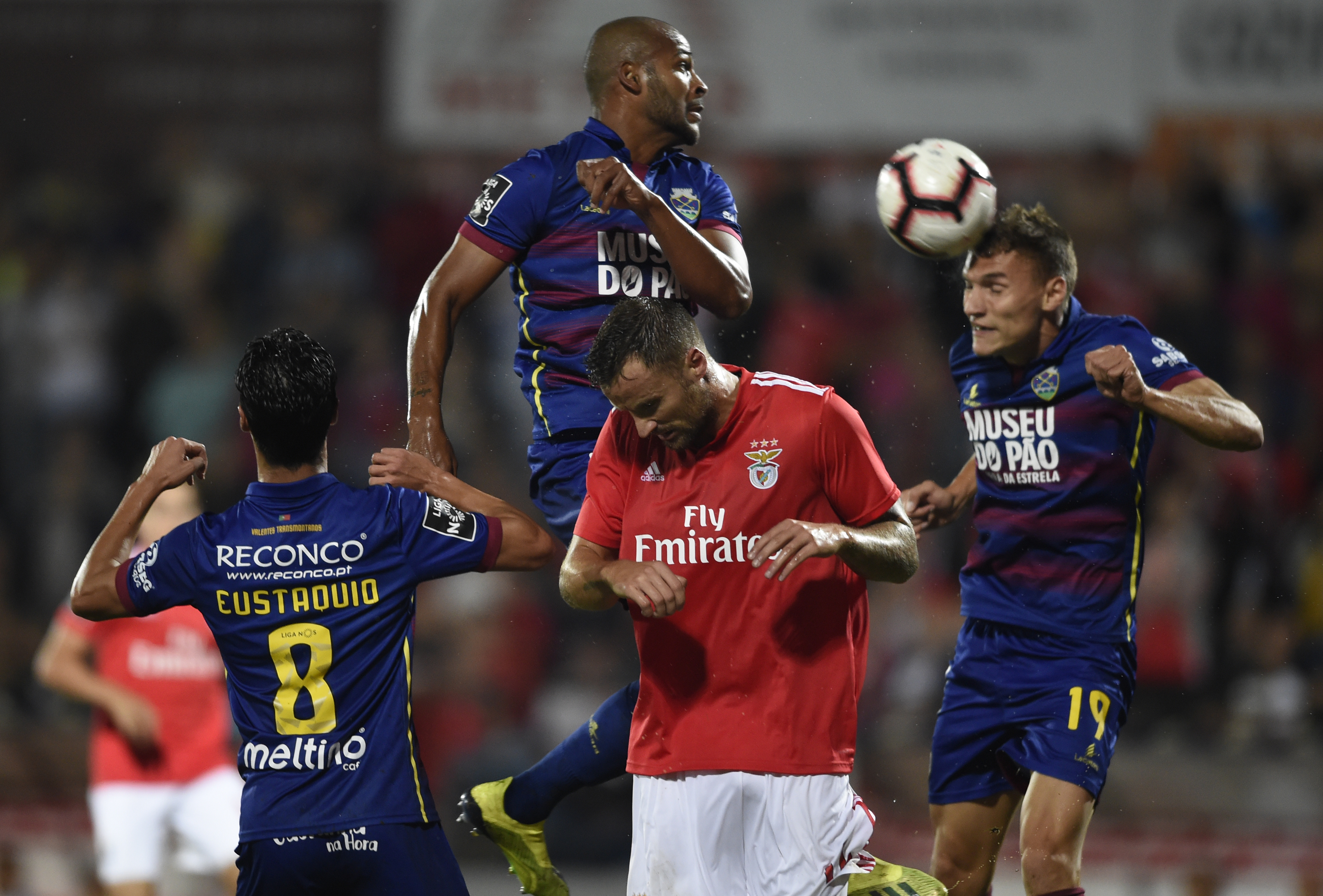Benfica's Swiss forward Haris Seferovic (C) jumps for the ball with Chaves' Portuguese midfielder Stephen Eustaquio (L), Brazilian defender Marcao (TOP) and Serbian defender Nikola Maras during the Portuguese league footbal match between GD Chaves and SL Benfica at the Municipal Eng. Manuel Branco Teixeira stadium in Chaves on September 27, 2018. (Photo by MIGUEL RIOPA / AFP)        (Photo credit should read MIGUEL RIOPA/AFP/Getty Images)