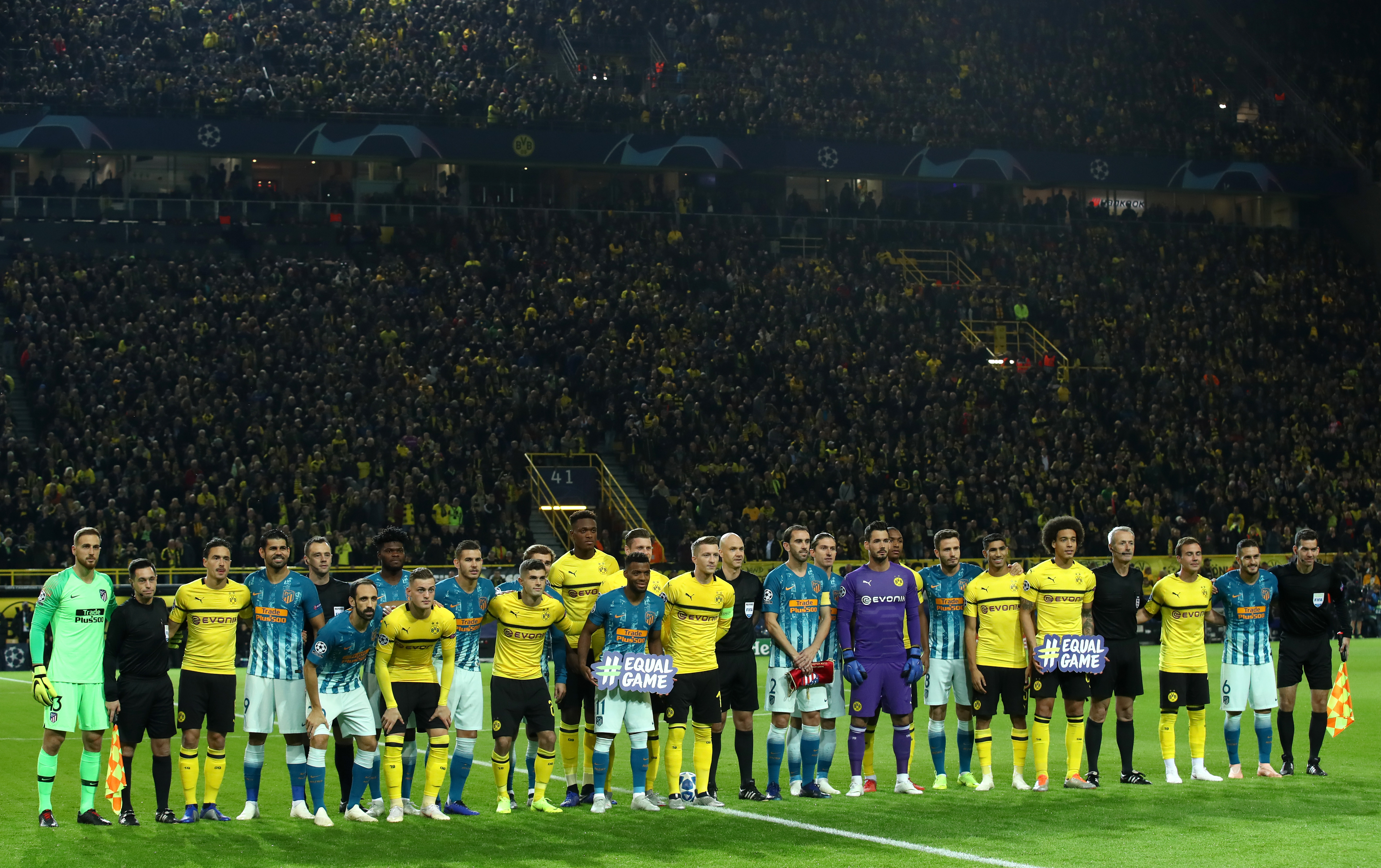 DORTMUND, GERMANY - OCTOBER 24: Borussia Dortmund and Club Atletico de Madrid players line up prior to the Group A match of the UEFA Champions League between Borussia Dortmund and Club Atletico de Madrid at Signal Iduna Park on October 24, 2018 in Dortmund, Germany.  (Photo by Alex Grimm/Bongarts/Getty Images)