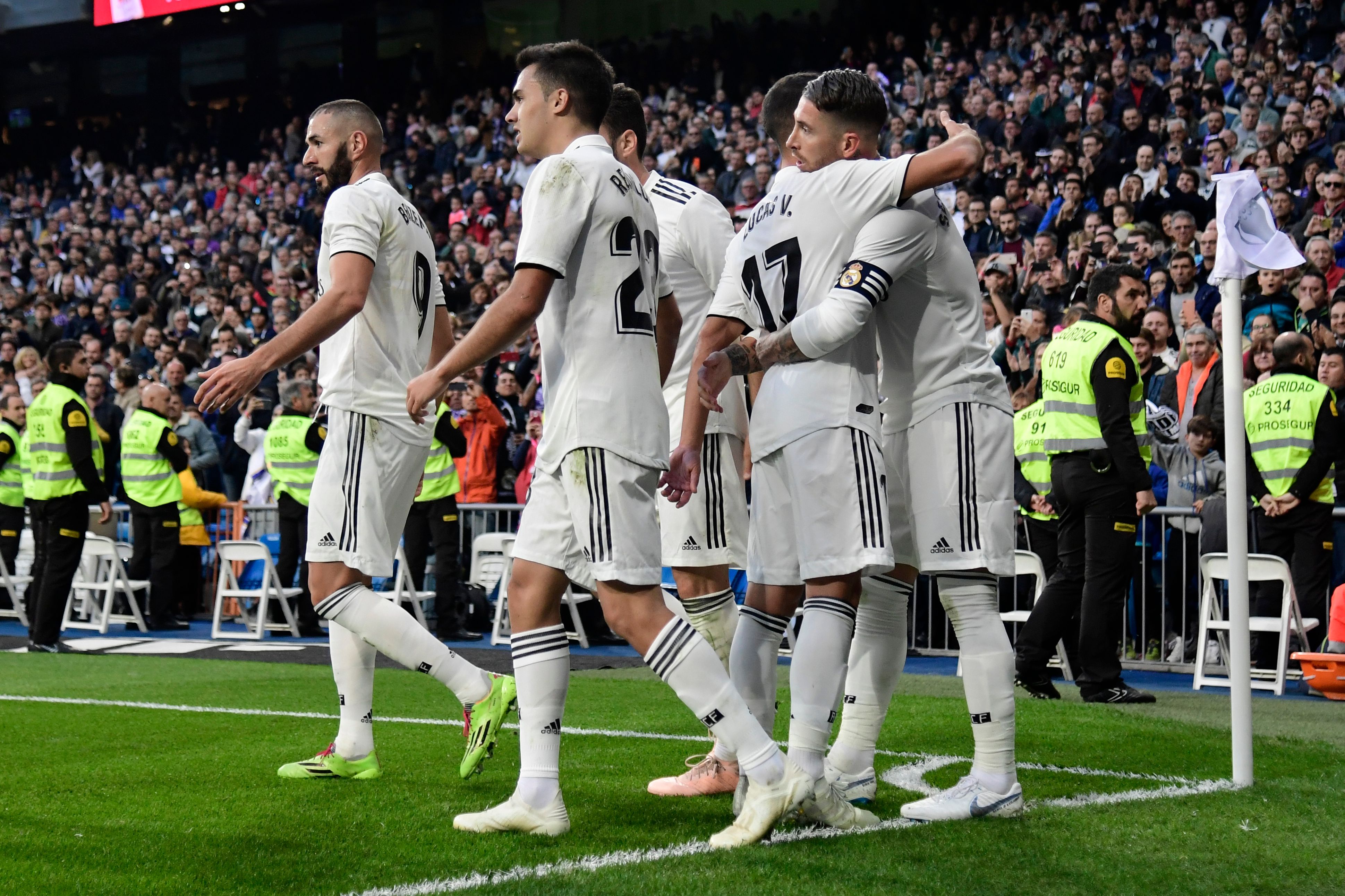 Real Madrid's Spanish defender Sergio Ramos (R) celebrates with teammates scoring his team's second goal during the Spanish league football match between Real Madrid CF and Real Valladolid FC at the Santiago Bernabeu stadium in Madrid on November 3, 2018. (Photo by JAVIER SORIANO / AFP)        (Photo credit should read JAVIER SORIANO/AFP/Getty Images)