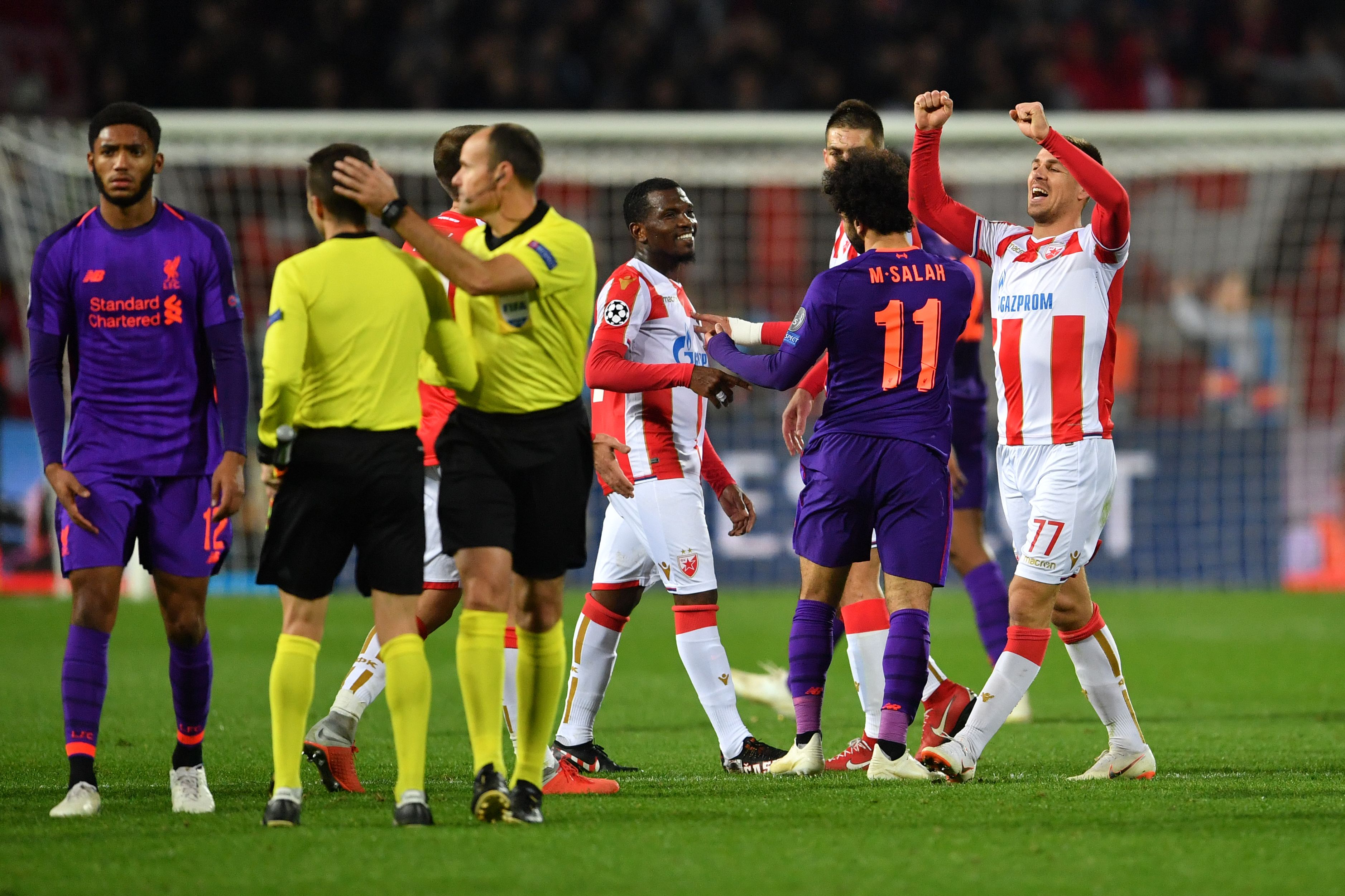 Red Star Belgrade's players and Liverpool's players react after the  UEFA Champions League Group C second-leg football match between Red Star Belgrade and Liverpool FC at the Rajko Mitic Stadium in Belgrade on November 6, 2018. (Photo by Andrej ISAKOVIC / AFP)        (Photo credit should read ANDREJ ISAKOVIC/AFP/Getty Images)