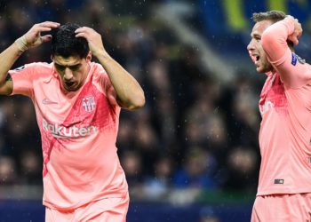 Barcelona's Uruguayan forward Luis Suarez (L) and Barcelona's Brazilian midfielder Arthur react during the UEFA Champions League group B football match Inter Milan vs Barcelona on November 6, 2018 at San Siro stadium in Milan. (Photo by Miguel MEDINA / AFP)        (Photo credit should read MIGUEL MEDINA/AFP/Getty Images)