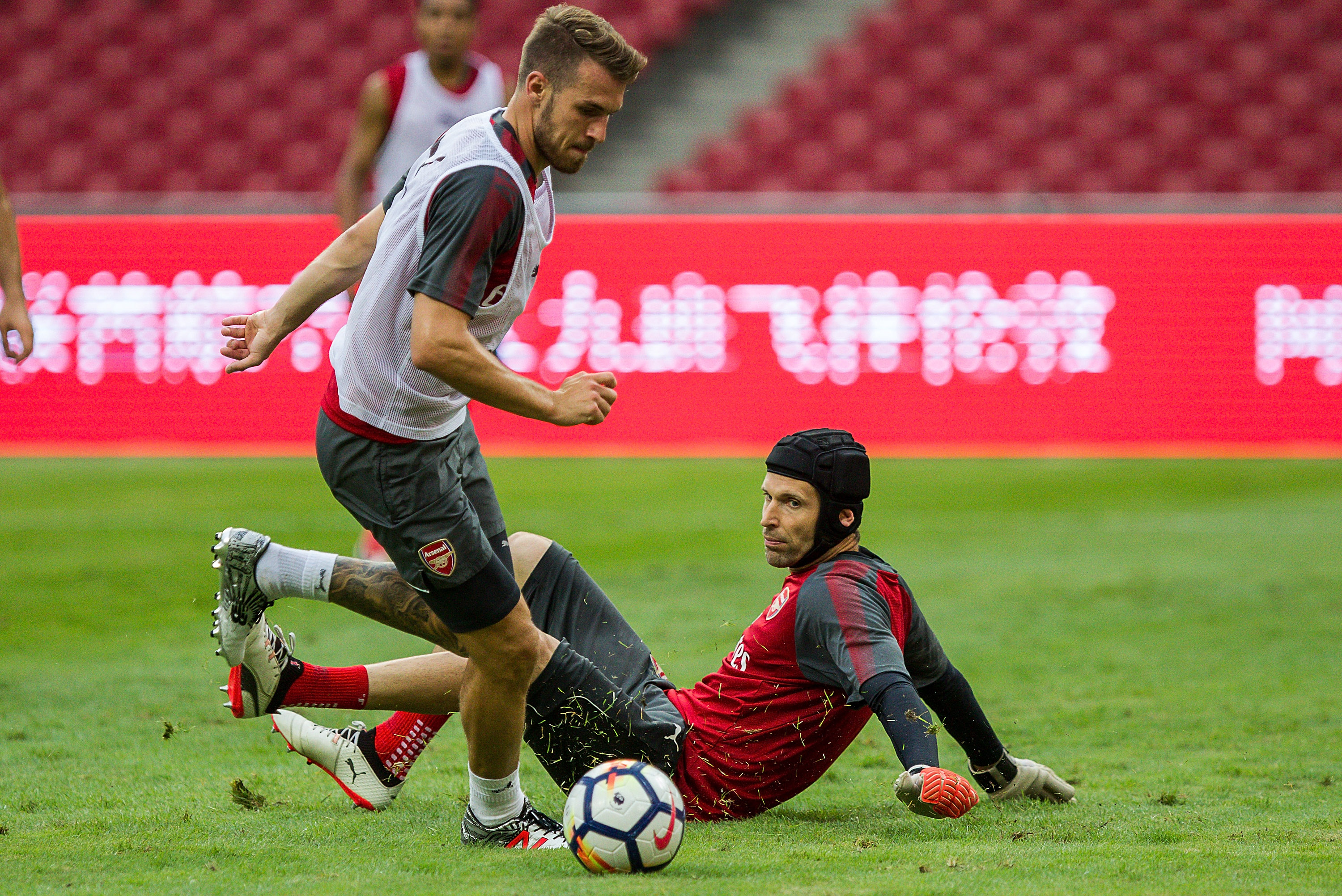 BEIJING, CHINA - JULY 21:  Aaron Ramsey goes past Petr Cech of Arsenal during a training session at Birds Nest on July 21, 2017 in Beijing, China.  (Photo by Yifan Ding/Getty Images)