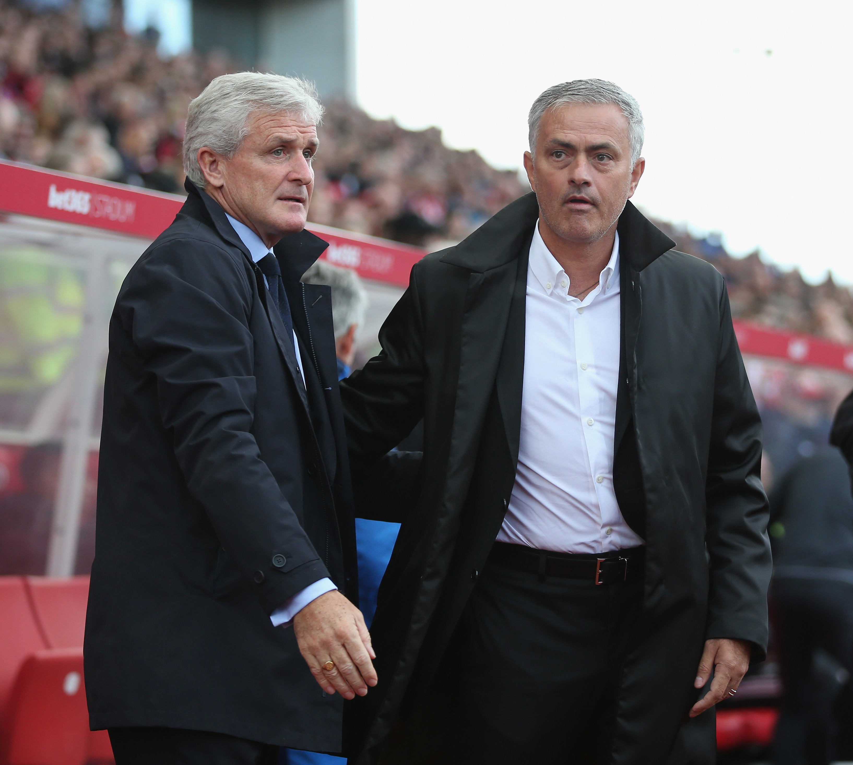 STOKE ON TRENT, ENGLAND - SEPTEMBER 09:  Stoke manager Mark Hughes and Manchester United manager Jose Mourinho during the Premier League match between Stoke City and Manchester United at Bet365 Stadium on September 9, 2017 in Stoke on Trent, England.  (Photo by Alex Morton/Getty Images)
