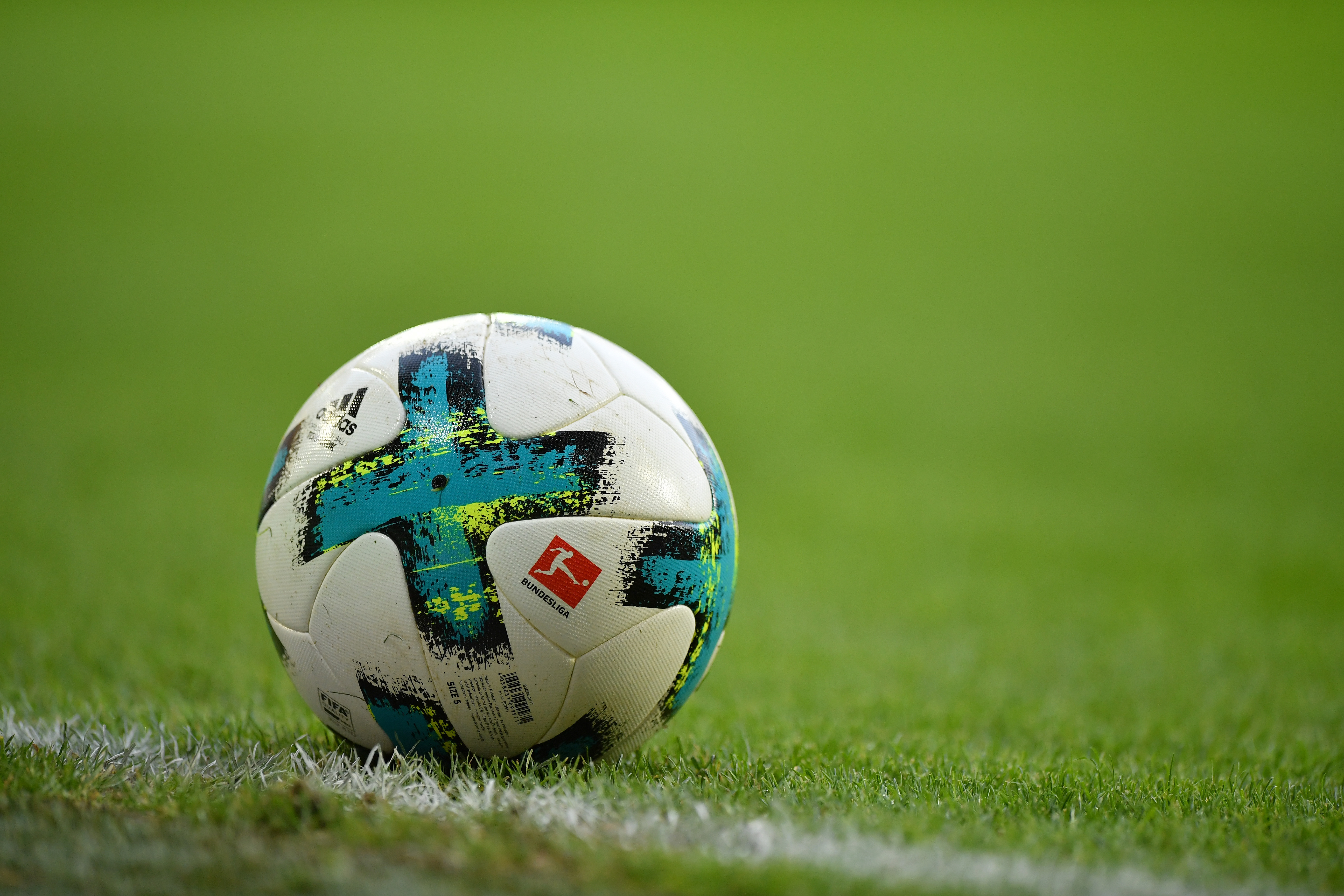 AUGSBURG, GERMANY - NOVEMBER 04: The ball with the Bundesliga logo lies on the pitch during the Bundesliga match between FC Augsburg and Bayer 04 Leverkusen at WWK-Arena on November 4, 2017 in Augsburg, Germany. (Photo by Sebastian Widmann/Bongarts/Getty Images)