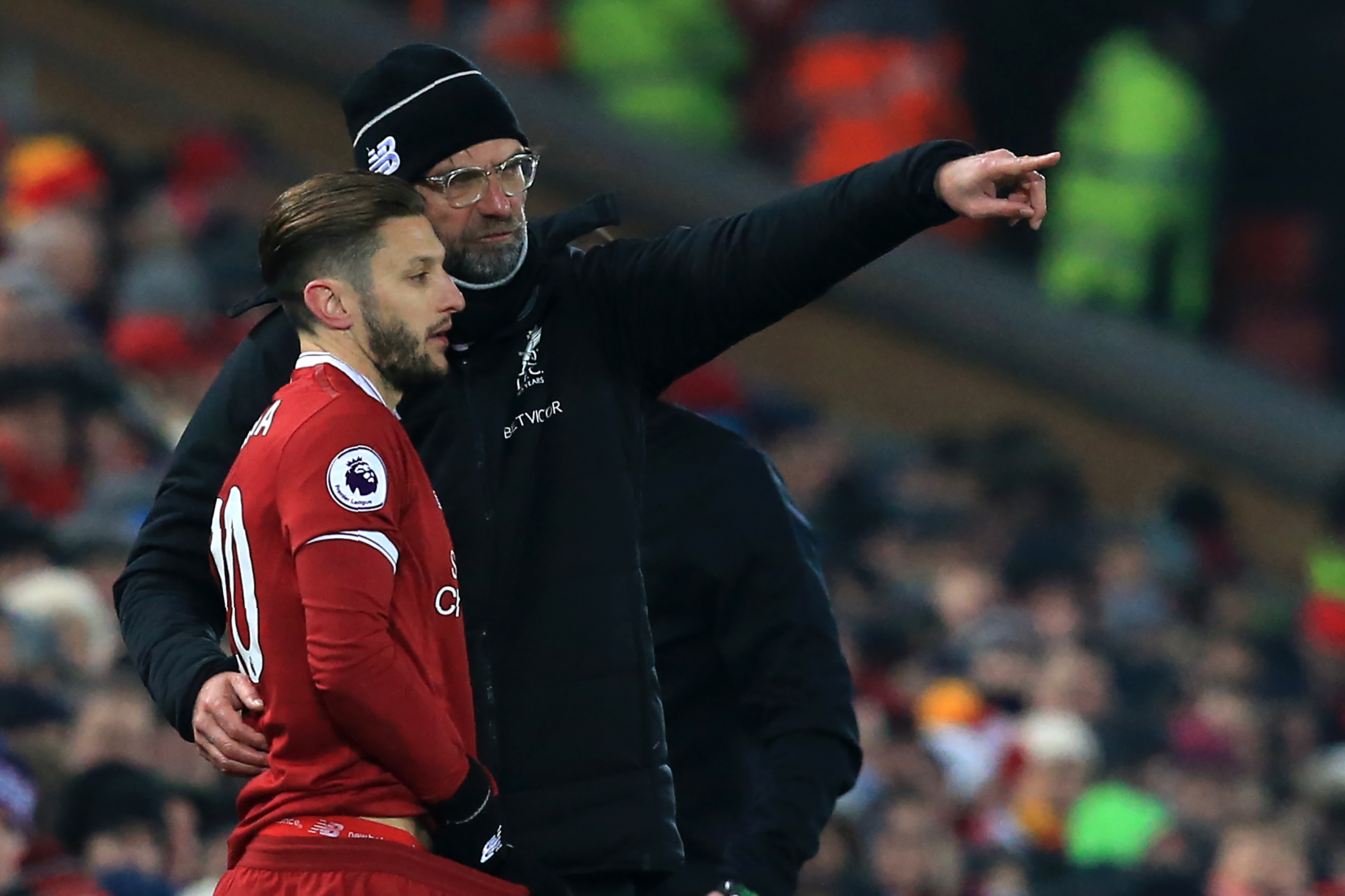 Liverpool's German manager Jurgen Klopp gives instructions to Liverpool's English midfielder Adam Lallana as he comes on as a substitute during the English Premier League football match between Liverpool and Newcastle at Anfield in Liverpool, north west England on March 3, 2018. / AFP PHOTO / Lindsey PARNABY / RESTRICTED TO EDITORIAL USE. No use with unauthorized audio, video, data, fixture lists, club/league logos or 'live' services. Online in-match use limited to 75 images, no video emulation. No use in betting, games or single club/league/player publications.  /         (Photo credit should read LINDSEY PARNABY/AFP/Getty Images)
