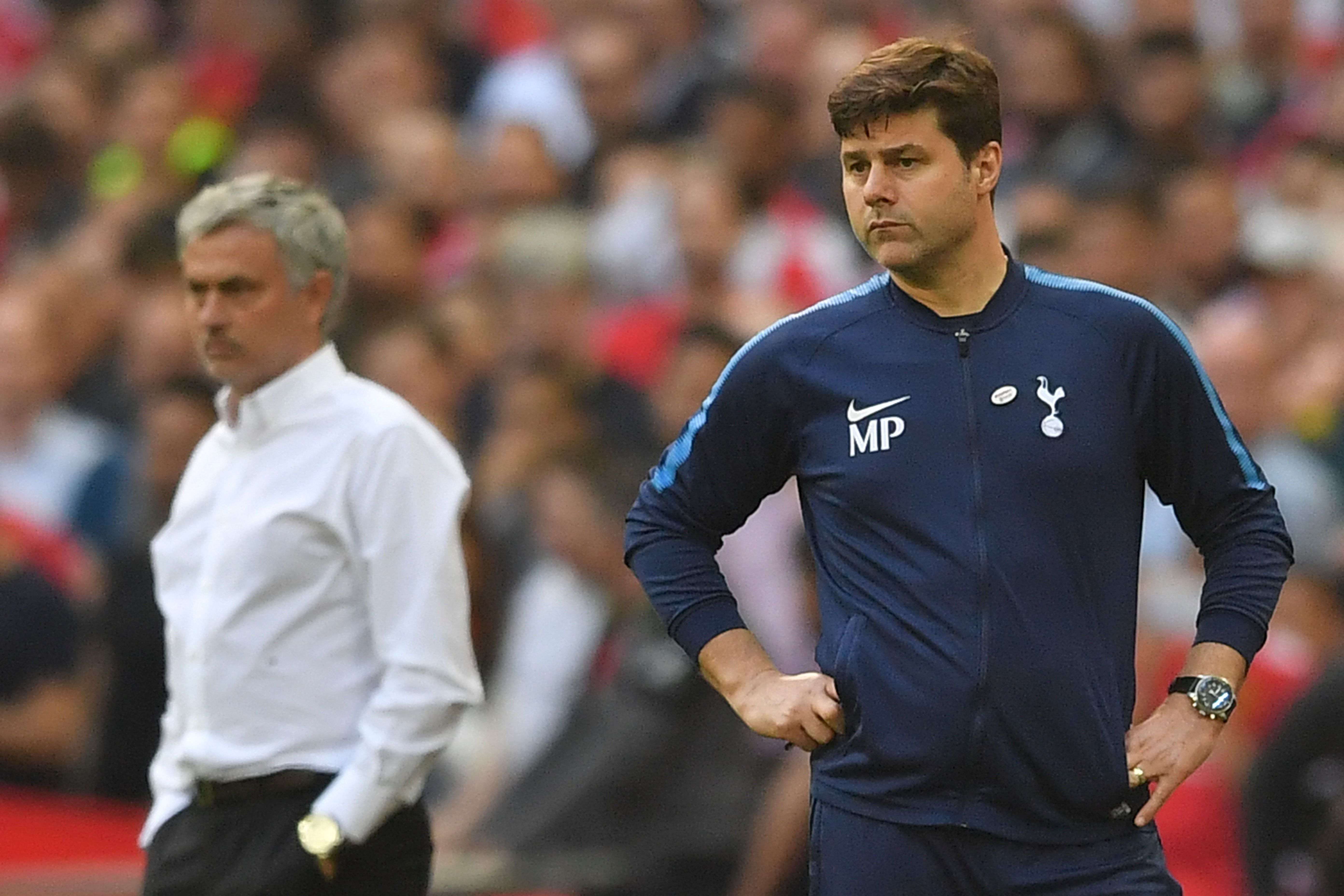 Manchester United's Portuguese manager Jose Mourinho (L) and Tottenham Hotspur's Argentinian head coach Mauricio Pochettino look on during the English FA Cup semi-final football match between Tottenham Hotspur and Manchester United at Wembley Stadium in London, on April 21, 2018. (Photo by Ben STANSALL / AFP) / NOT FOR MARKETING OR ADVERTISING USE / RESTRICTED TO EDITORIAL USE        (Photo credit should read BEN STANSALL/AFP/Getty Images)