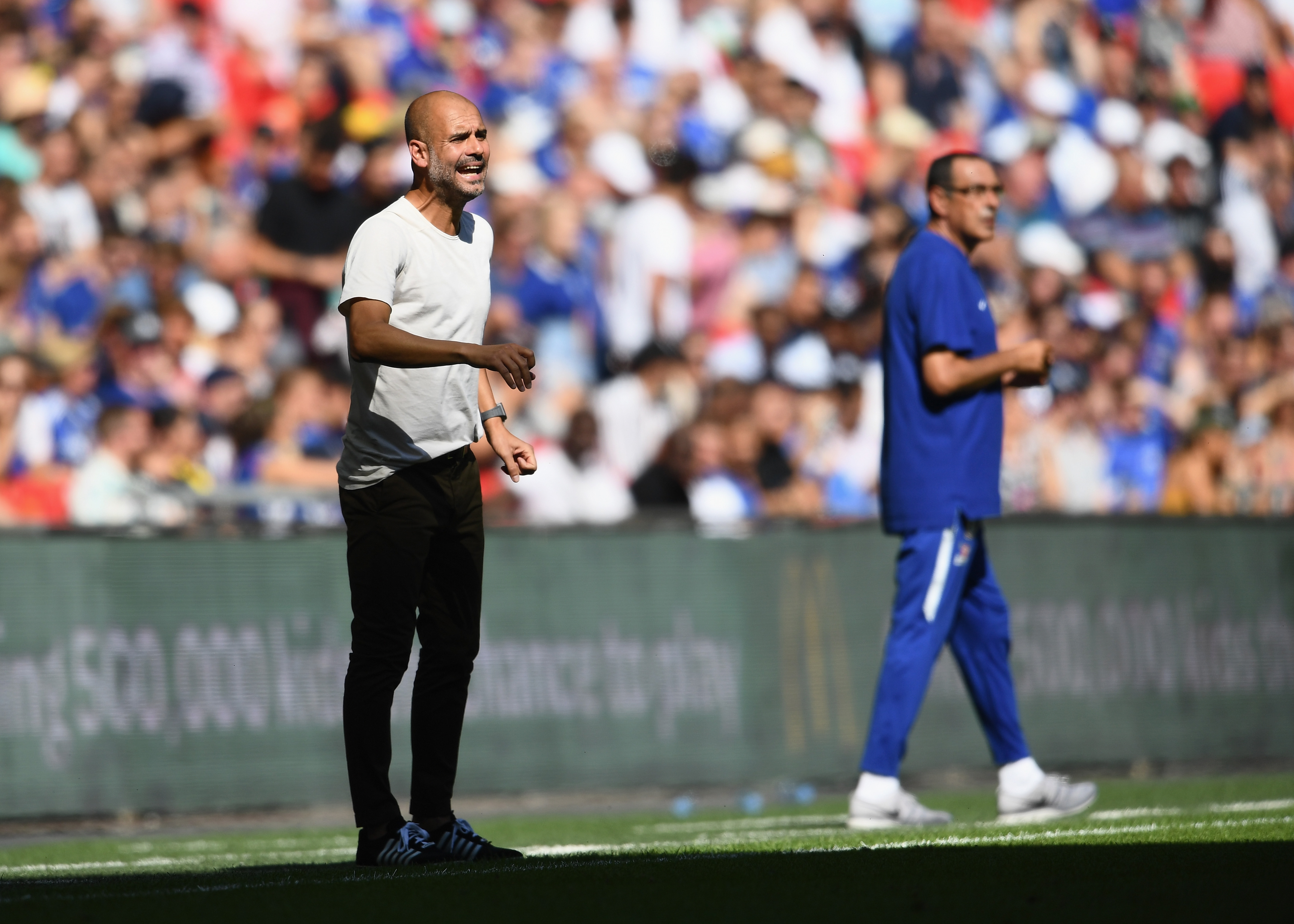 LONDON, ENGLAND - AUGUST 05:  Josep Guardiola, Manager of Manchester City reacts alongside Maurizio Sarri, Head Coach of Chelsea during the FA Community Shield between Manchester City and Chelsea at Wembley Stadium on August 5, 2018 in London, England.  (Photo by Clive Mason/Getty Images)