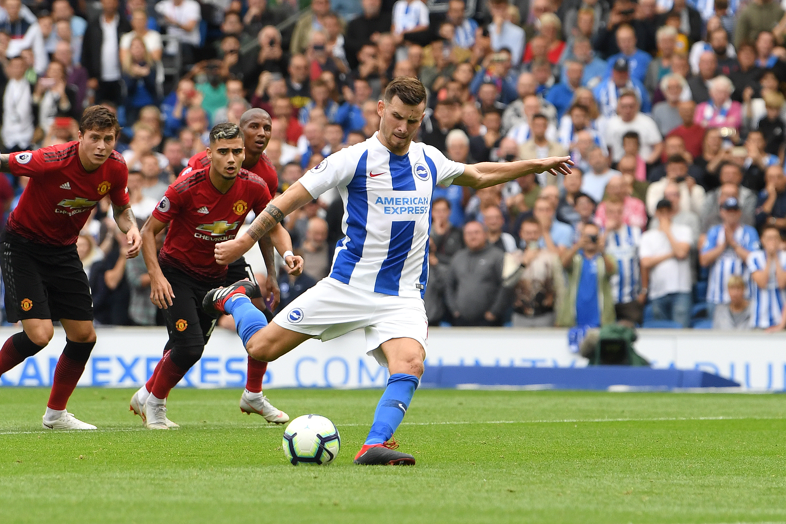 BRIGHTON, ENGLAND - AUGUST 19:  Pascal Gross of Brighton and Hove Albion shoots and scores his side's third goal from a penalty during the Premier League match between Brighton & Hove Albion and Manchester United at American Express Community Stadium on August 19, 2018 in Brighton, United Kingdom.  (Photo by Mike Hewitt/Getty Images)