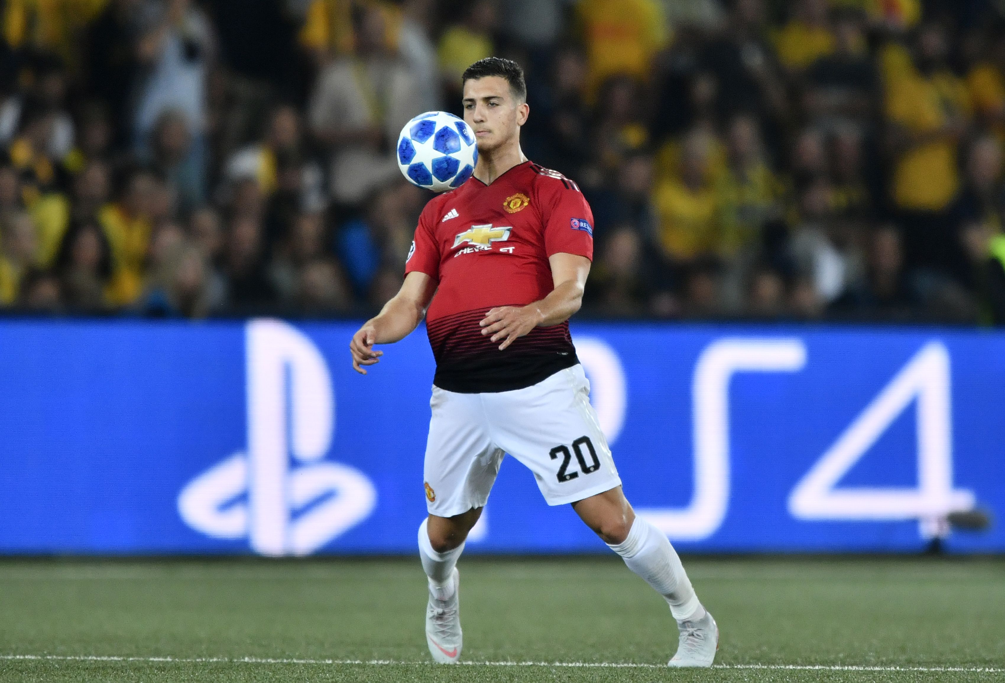 Manchester United's Portuguese defender Diogo Dalot controls the ball during the UEFA Champions League group H football match between Young Boys and Manchester United at The Stade de Suisse in Bern on September 19, 2018. (Photo by Fabrice COFFRINI / AFP)        (Photo credit should read FABRICE COFFRINI/AFP/Getty Images)