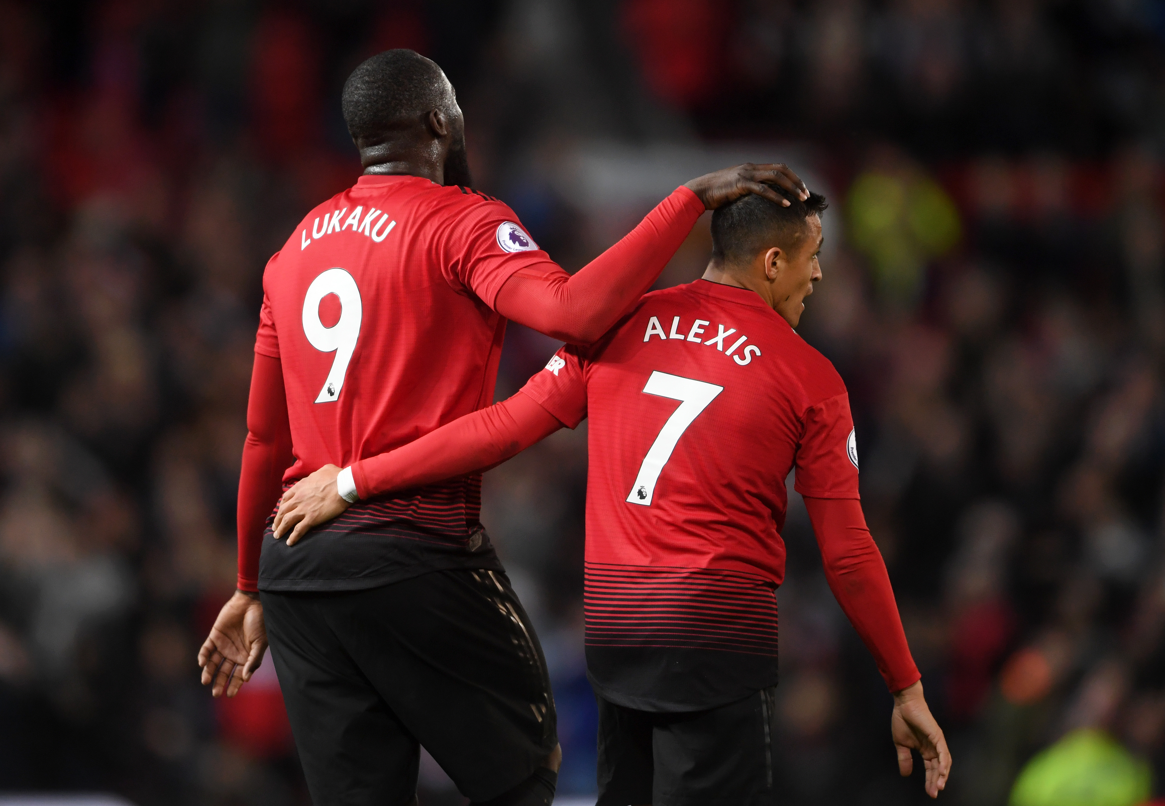 MANCHESTER, ENGLAND - OCTOBER 06:  Romelu Lukaku and Alexis Sanchez of Manchester United celebrate following their sides victory in the Premier League match between Manchester United and Newcastle United at Old Trafford on October 6, 2018 in Manchester, United Kingdom.  (Photo by Laurence Griffiths/Getty Images)