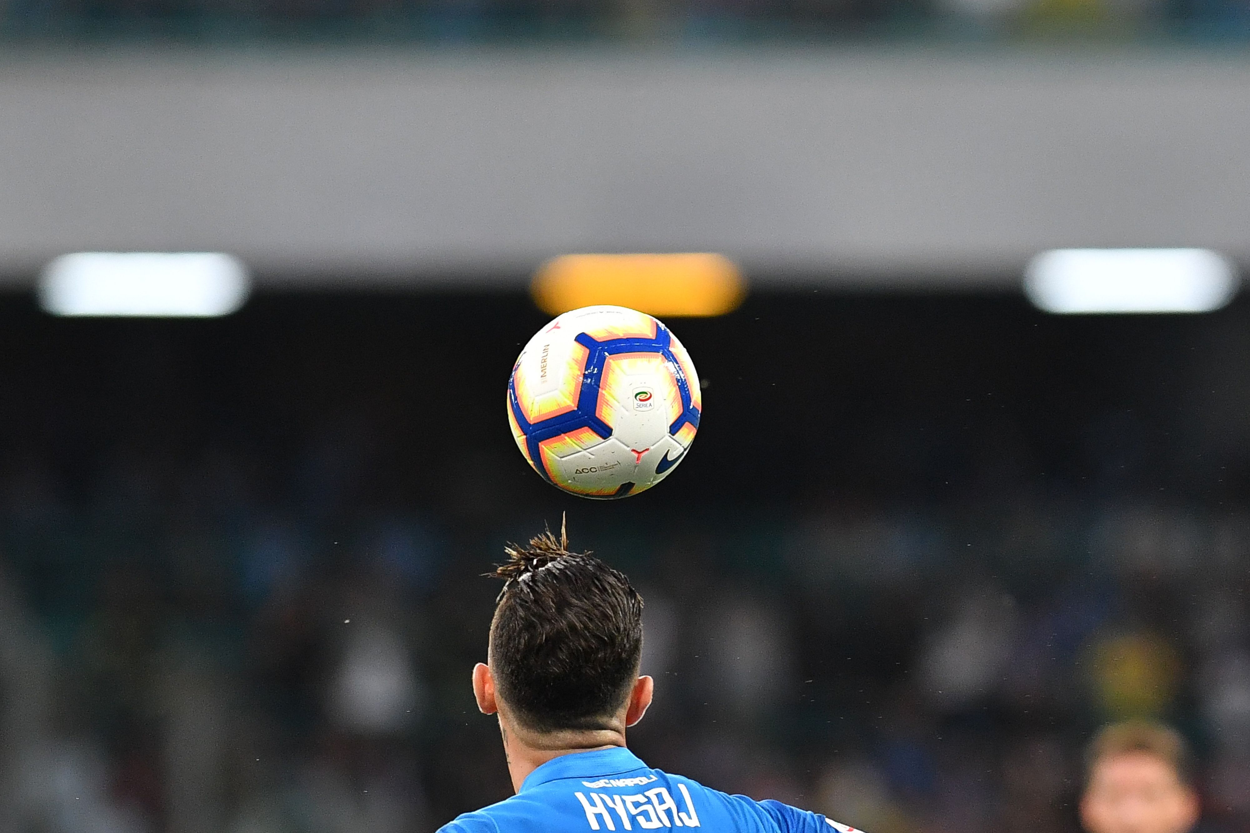 Napoli's Albanian defender Elseid Hysaj jumps for the ball during the Italian Serie A football match Napoli vs Sassuolo at the San Paolo Comunal Stadium in Naples, on October 7, 2018. (Photo by Andreas SOLARO / AFP)        (Photo credit should read ANDREAS SOLARO/AFP/Getty Images)