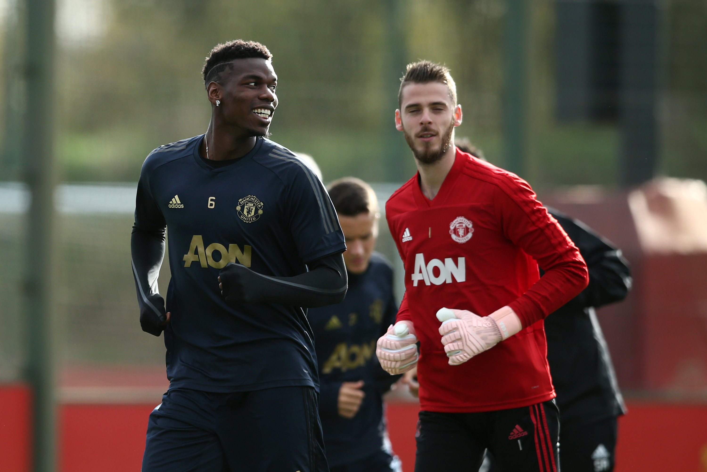 MANCHESTER, ENGLAND - OCTOBER 22:  Paul Pogba  and David De Gea of Manchester United warm up during a training session ahead of their UEFA Champions League Group H match against Juventus at Aon Training Complex on October 22, 2018 in Manchester, England.  (Photo by Jan Kruger/Getty Images)