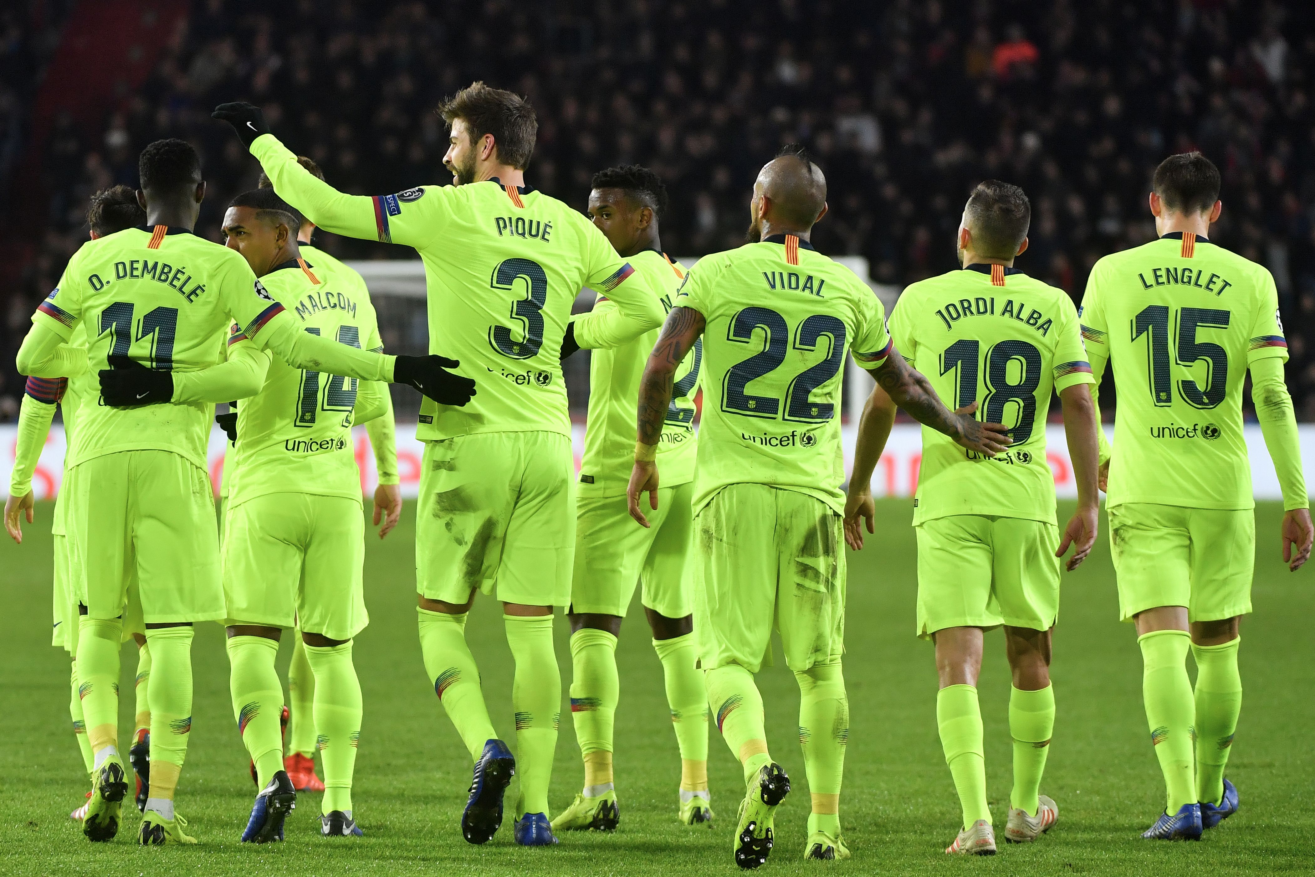 Barcelona's Spanish defender Gerard Pique (3rdL) celebrates with his teammates after scoring during the UEFA Champions League football match between PSV Eindhoven and FC Barcelona at Philips stadium in Eindhoven on November 28, 2018. (Photo by EMMANUEL DUNAND / AFP)        (Photo credit should read EMMANUEL DUNAND/AFP/Getty Images)
