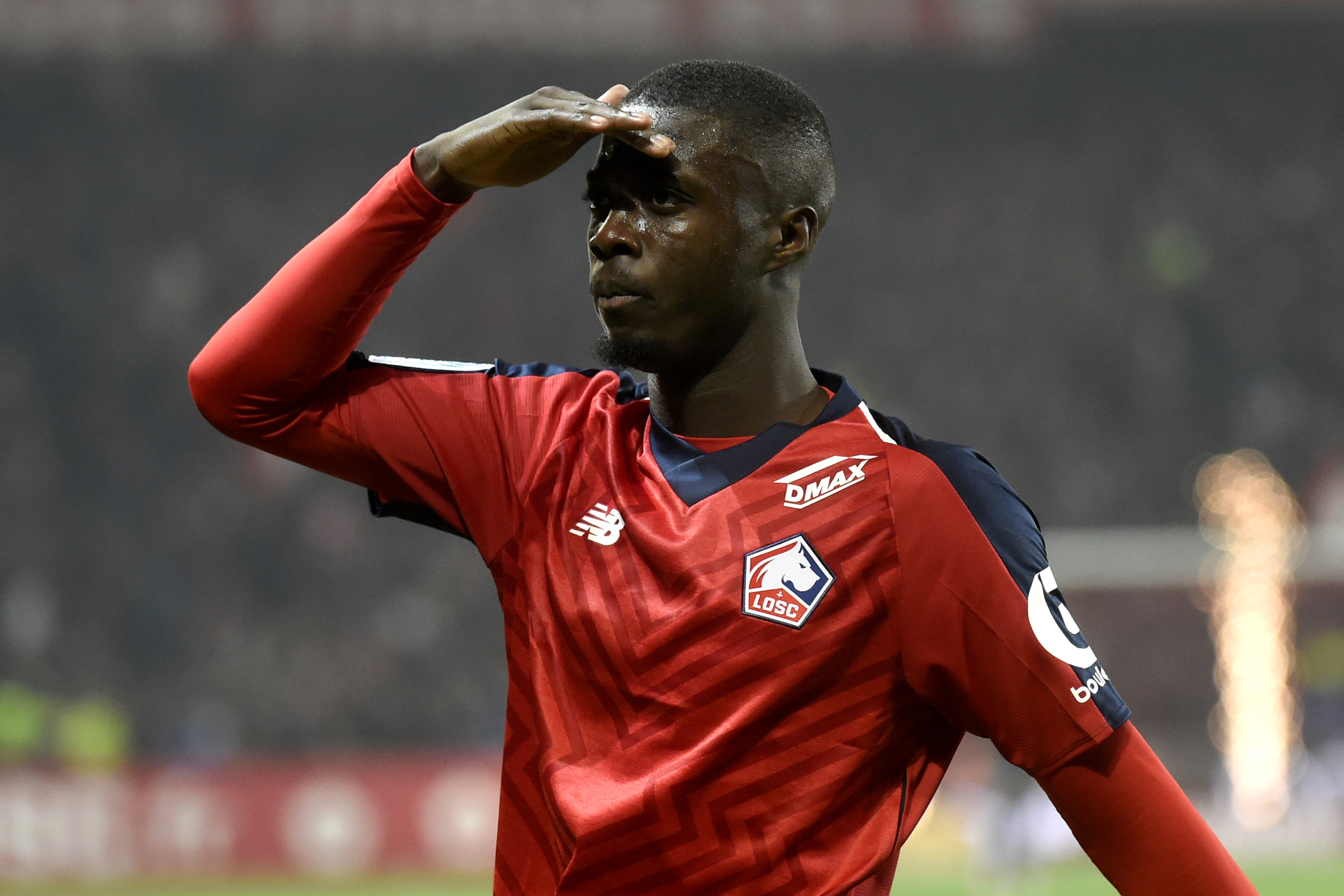 Lille's Ivorian forward Nicolas Pepe celebrates after scoring a goal during the French L1 football match between Lille (LOSC) and Olympique Lyonnais (OL) on December 1, 2018 at the Pierre Mauroy Stadium in Villenueve d'Ascq. (Photo by FRANCOIS LO PRESTI / AFP)        (Photo credit should read FRANCOIS LO PRESTI/AFP/Getty Images)