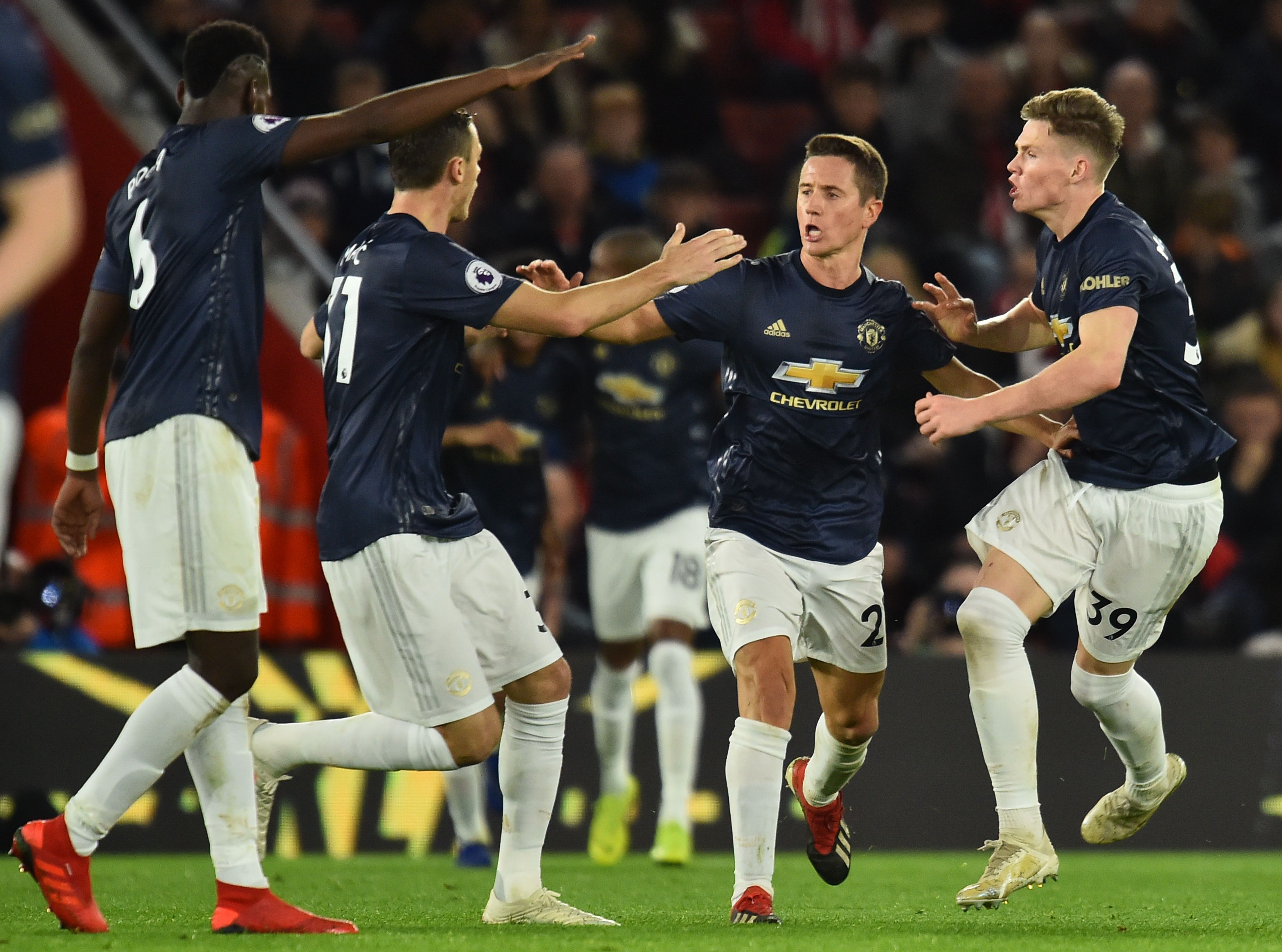 Manchester United's Spanish midfielder Ander Herrera (2R) celebrates scoring their second goal to equalise 2-2 during the English Premier League football match between Southampton and Manchester United at St Mary's Stadium in Southampton, southern England on December 1, 2018. (Photo by Glyn KIRK / AFP) / RESTRICTED TO EDITORIAL USE. No use with unauthorized audio, video, data, fixture lists, club/league logos or 'live' services. Online in-match use limited to 120 images. An additional 40 images may be used in extra time. No video emulation. Social media in-match use limited to 120 images. An additional 40 images may be used in extra time. No use in betting publications, games or single club/league/player publications. /         (Photo credit should read GLYN KIRK/AFP/Getty Images)