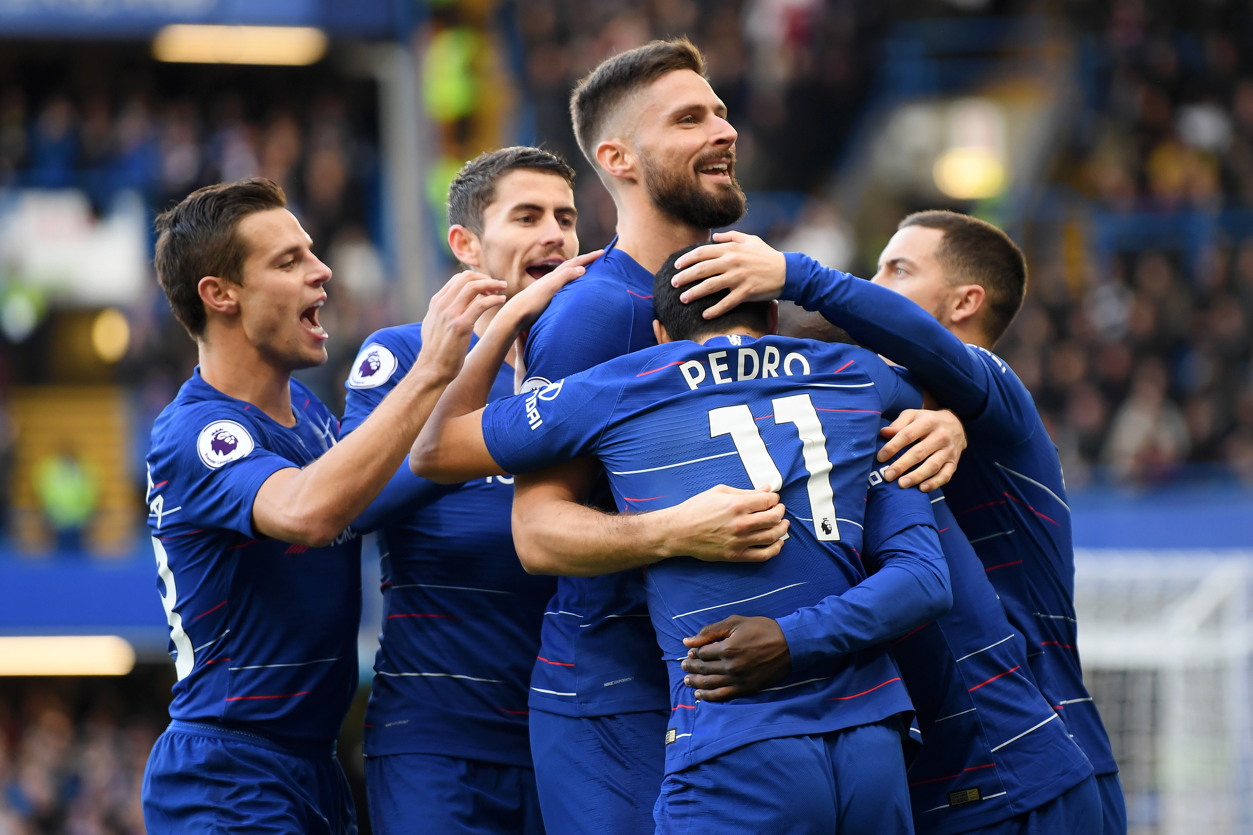 LONDON, ENGLAND - DECEMBER 02:  Pedro of Chelsea celebrates with teammates after scoring his team's first goal during the Premier League match between Chelsea FC and Fulham FC at Stamford Bridge on December 2, 2018 in London, United Kingdom.  (Photo by Mike Hewitt/Getty Images)