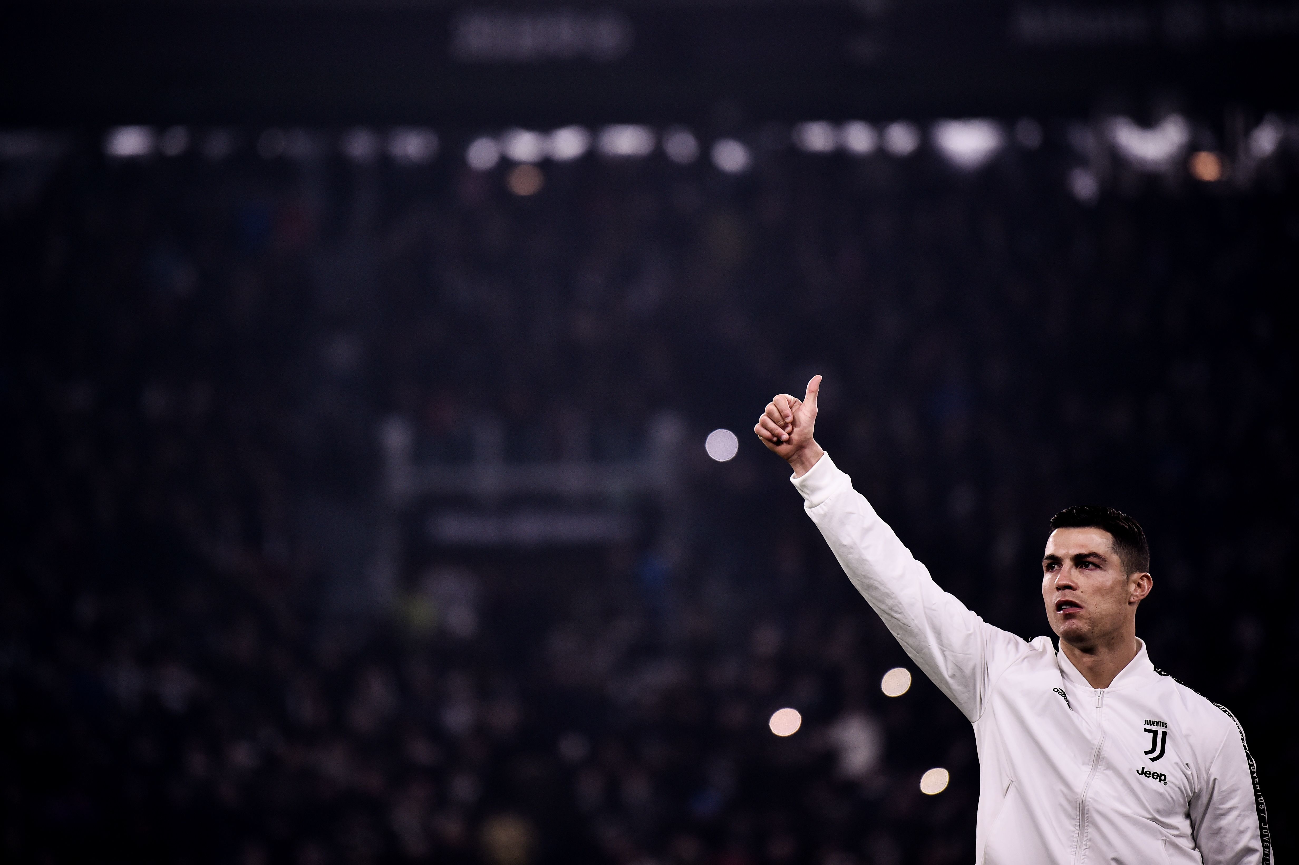 Juventus' Portuguese forward Cristiano Ronaldo thumbs up to supporters prior to the start of the Serie A football match between Juventus and InterMilan at the Stadio delle Alpi on December 7, 2018. (Photo by Marco BERTORELLO / AFP)        (Photo credit should read MARCO BERTORELLO/AFP/Getty Images)