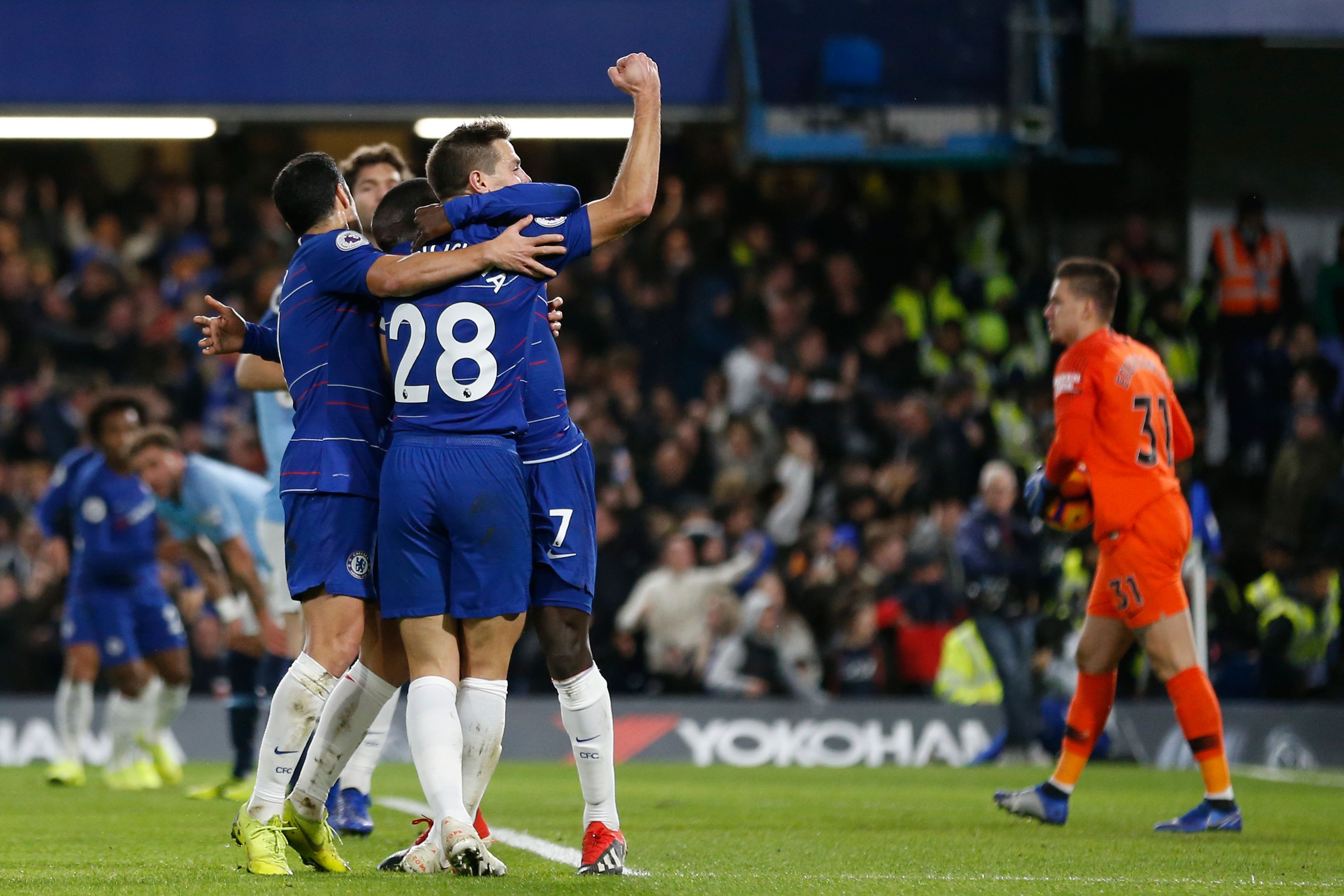 Chelsea's French midfielder N'Golo Kante celebrates with Chelsea's Spanish defender Cesar Azpilicueta (R) afer scoring during the English Premier League football match between Chelsea and Manchester City at Stamford Bridge in London on December 8, 2018. (Photo by Ian KINGTON / AFP) / RESTRICTED TO EDITORIAL USE. No use with unauthorized audio, video, data, fixture lists, club/league logos or 'live' services. Online in-match use limited to 120 images. An additional 40 images may be used in extra time. No video emulation. Social media in-match use limited to 120 images. An additional 40 images may be used in extra time. No use in betting publications, games or single club/league/player publications. /         (Photo credit should read IAN KINGTON/AFP/Getty Images)