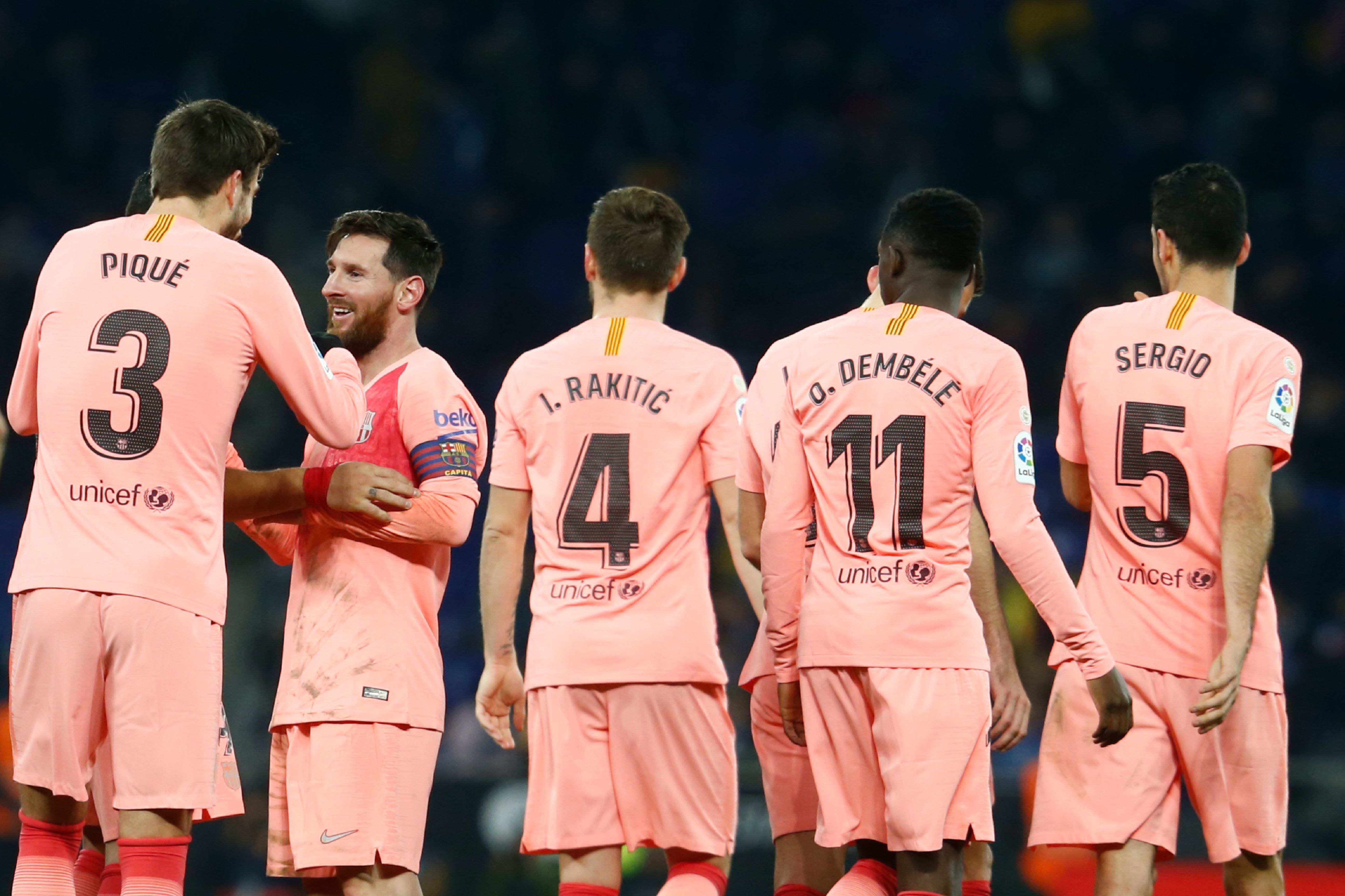 Barcelona's Argentinian forward Lionel Messi (2L) celebrates  with Barcelona's Spanish defender Gerard Pique  after scoring during the Spanish league football match RCD Espanyol against FC Barcelona at the RCDE Stadium in Cornella de Llobregat on December 8, 2018. (Photo by PAU BARRENA / AFP)        (Photo credit should read PAU BARRENA/AFP/Getty Images)