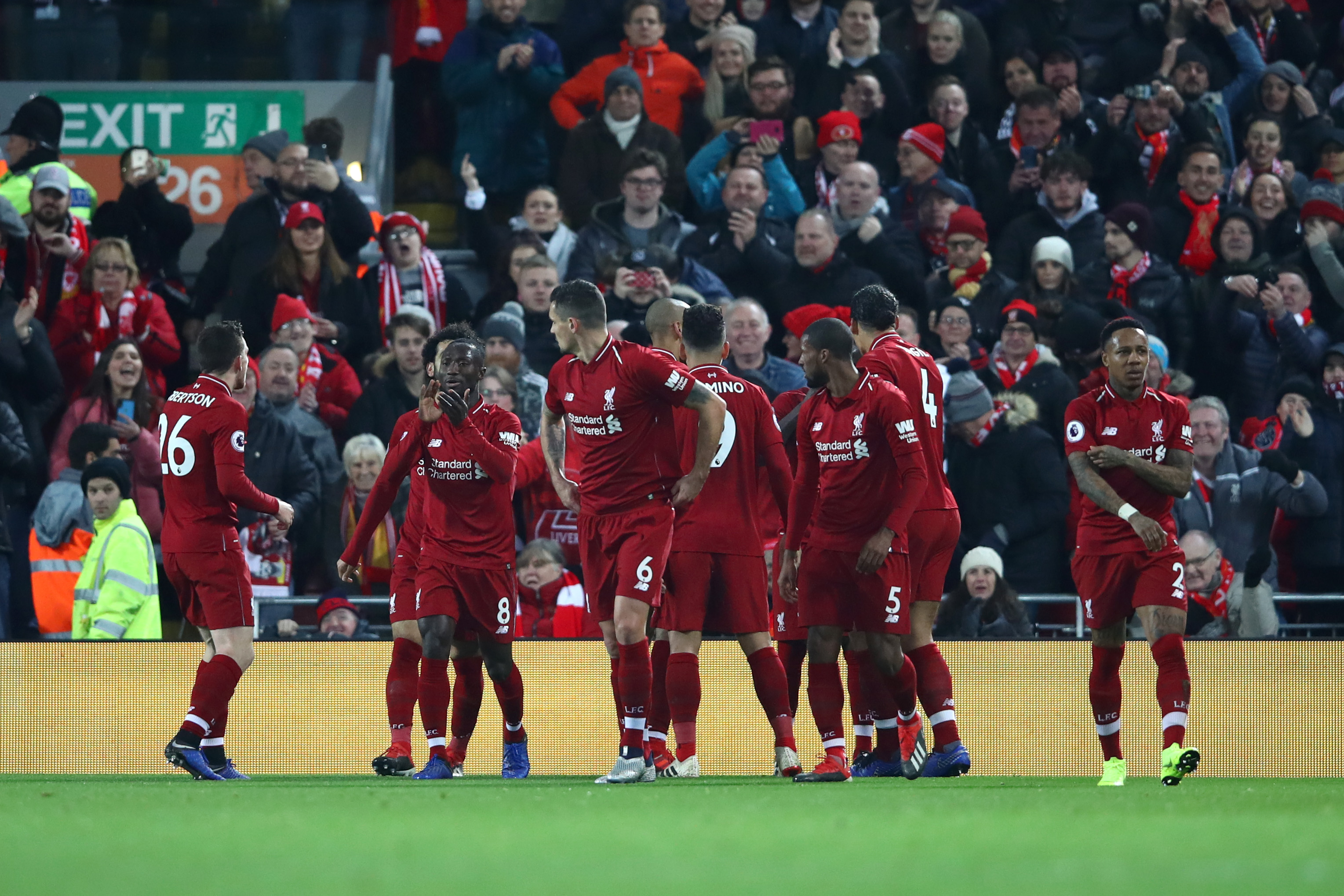 LIVERPOOL, ENGLAND - DECEMBER 16:  Sadio Mane of Liverpool (hidden) celebrates with team mates after scoring his team's first goal during the Premier League match between Liverpool FC and Manchester United at Anfield on December 16, 2018 in Liverpool, United Kingdom.  (Photo by Clive Brunskill/Getty Images)