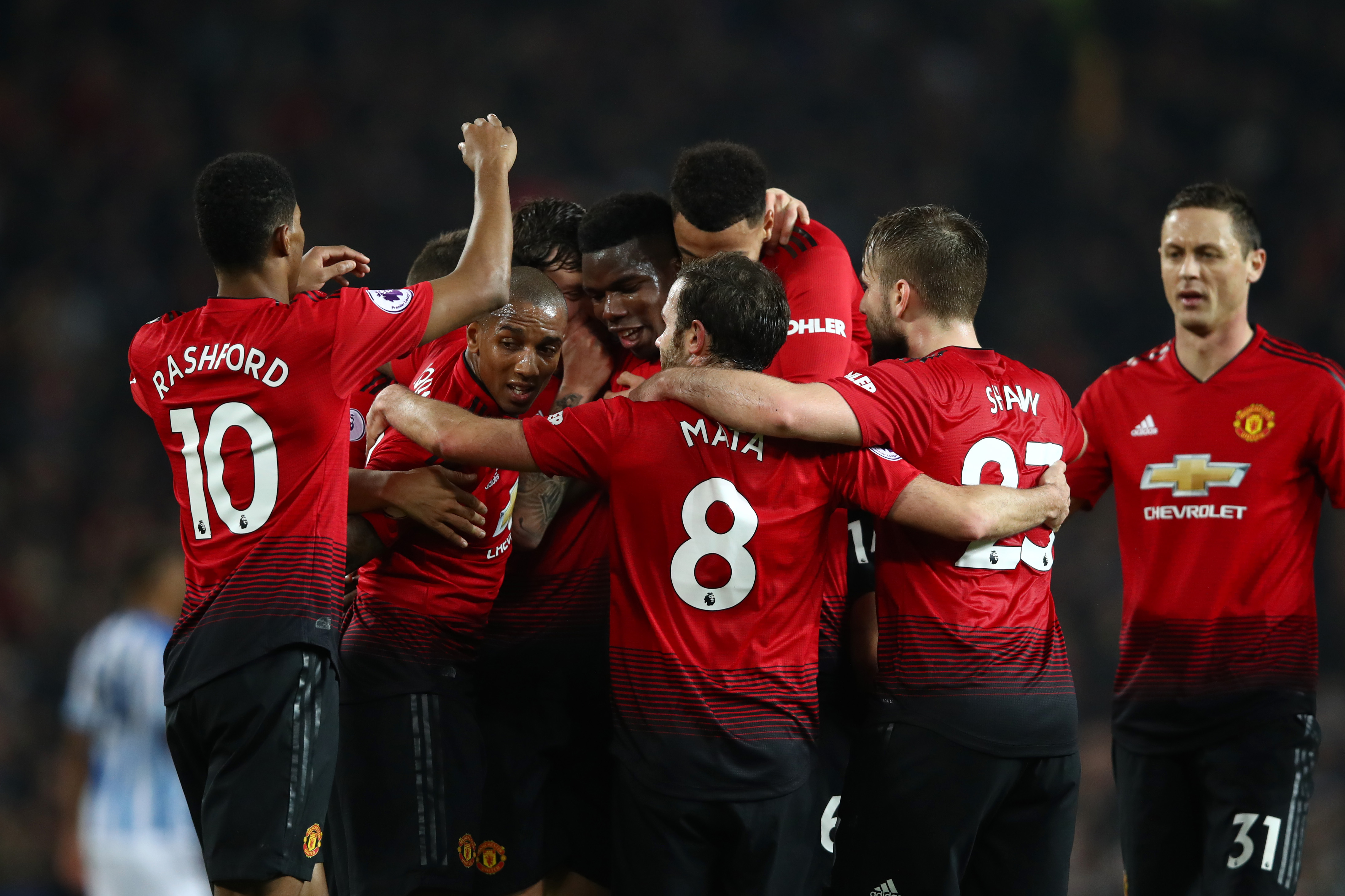 MANCHESTER, ENGLAND - DECEMBER 26:  Paul Pogba of Manchester United celebrates with team mates after scoring their team's third goal during the Premier League match between Manchester United and Huddersfield Town at Old Trafford on December 26, 2018 in Manchester, United Kingdom.  (Photo by Clive Brunskill/Getty Images)