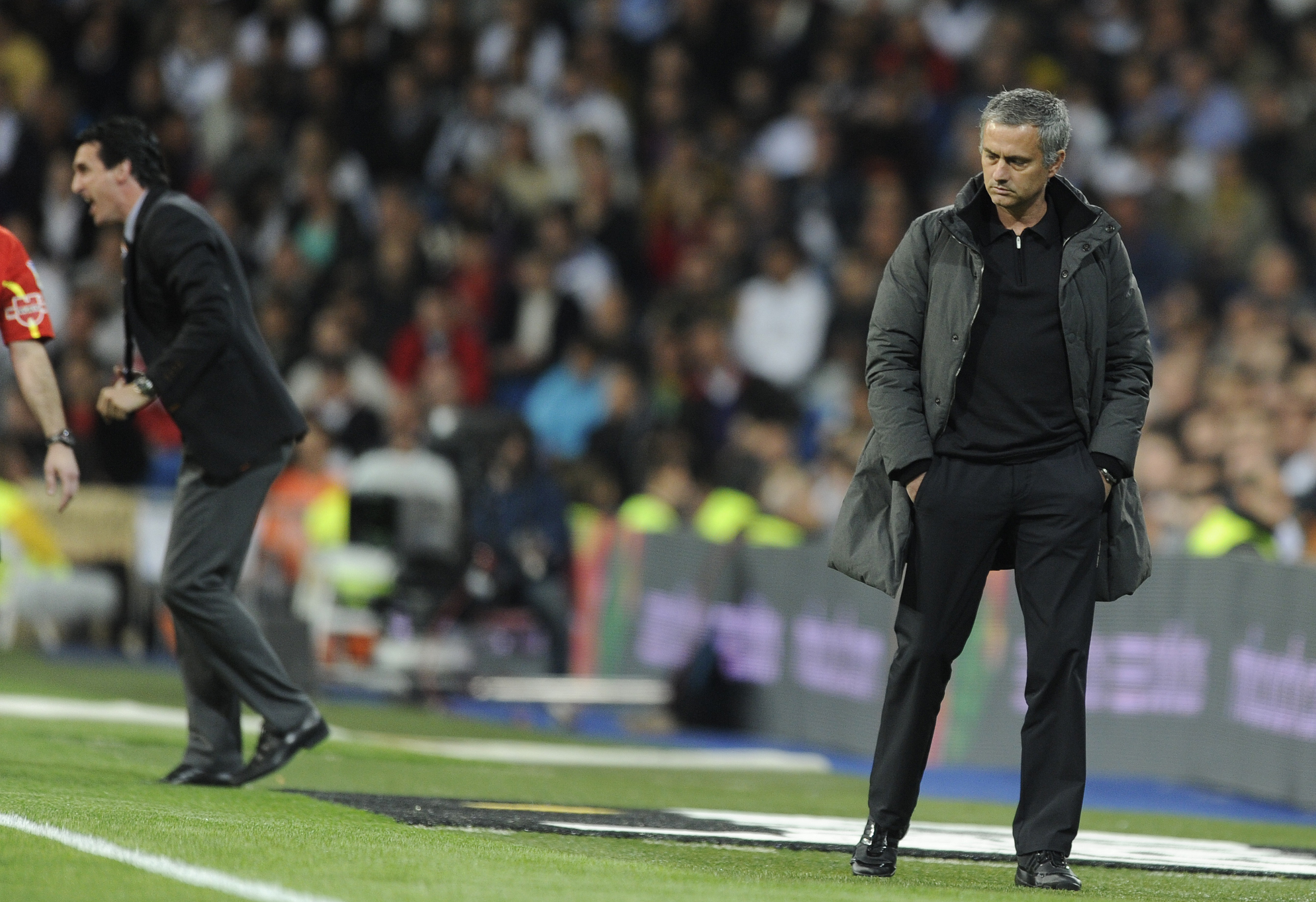 Valencia's coach Unai Emery (L) and Real Madrid's Portuguese coach Jose Mourinho (R) react during the Spanish league football match Real Madrid against Valencia at the Santiago Bernabeu stadium in Madrid, on April 08, 2012.  AFP PHOTO/DOMINIQUE FAGET (Photo credit should read DOMINIQUE FAGET/AFP/Getty Images)