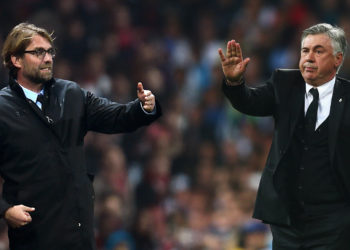 (FILE PHOTO) In this composite image a comparison has been made between Jurgen Klopp (L) and Carlo Ancelotti (R) as candidates for the vanact Liverpool manager role after the sacking of Brendan Rodgers.  ***LEFT IMAGE***   LONDON, ENGLAND - NOVEMBER 26: (EDITORS NOTE: This image has been flipped and blended into the image on the right)  Jurgen Klopp the Borussia Dortmund manager gestures during the UEFA Champions League Group D match between Arsenal and Borussia Dortmund at the Emirates Stadium on November 26, 2014 in London, United Kingdom. (Photo by Jamie McDonald/Getty Images)    ***RIGHT IMAGE*** MADRID, SPAIN - APRIL 23:  Carlo Ancelotti, coach of Real Madrid gives instructions during the UEFA Champions League semi-final first leg match between Real Madrid and FC Bayern Muenchen at the Estadio Santiago Bernabeu on April 23, 2014 in Madrid, Spain.  (Photo by Paul Gilham/Getty Images)