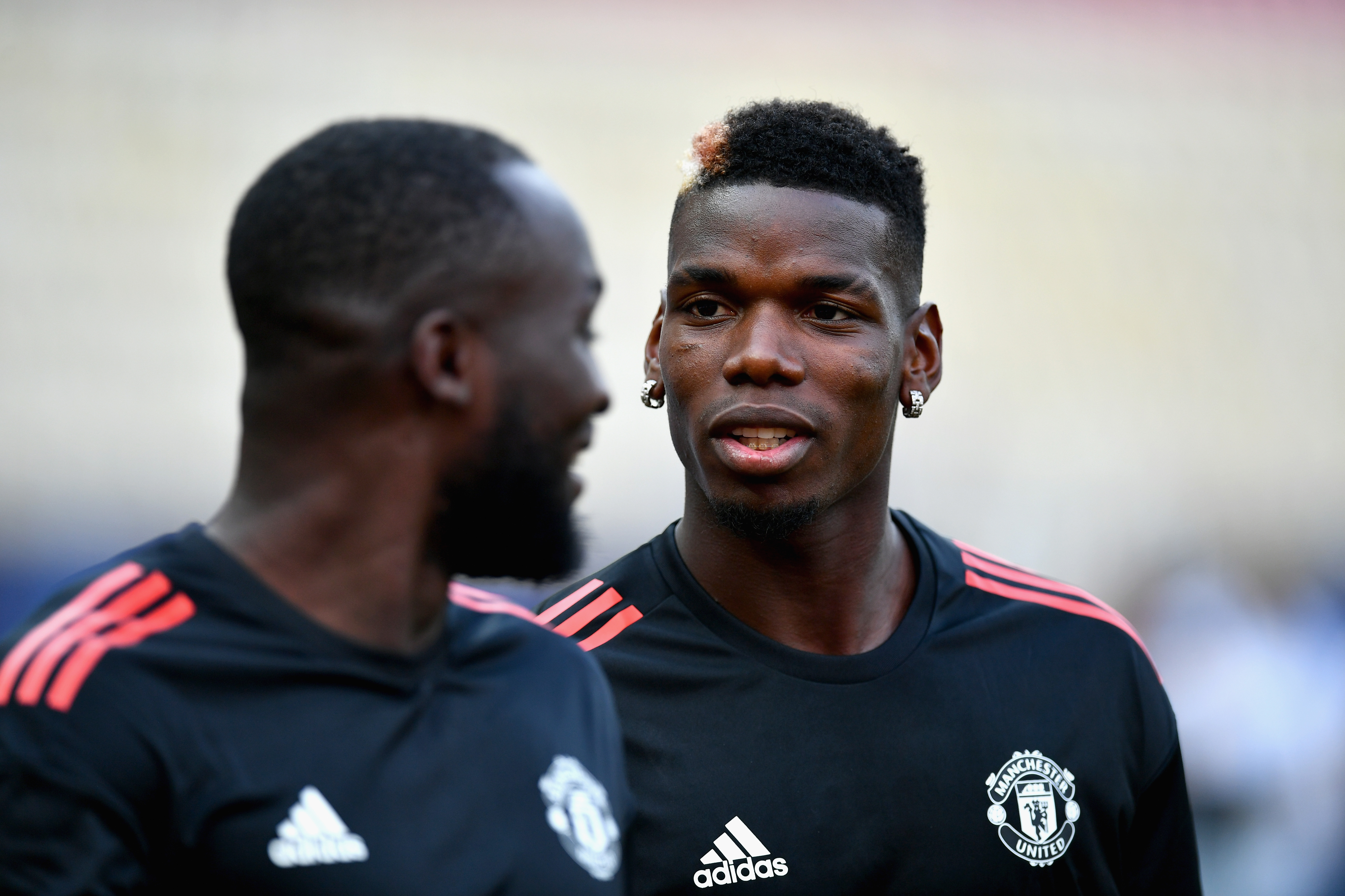 SKOPJE, MACEDONIA - AUGUST 07:  Paul Pogba of Manchester United speaks to Romelu Lukaku of Manchester United during a training session ahead of the UEFA Super Cup final between Real Madrid and Manchester United on August 7, 2017 in Skopje, Macedonia.  (Photo by Dan Mullan/Getty Images)