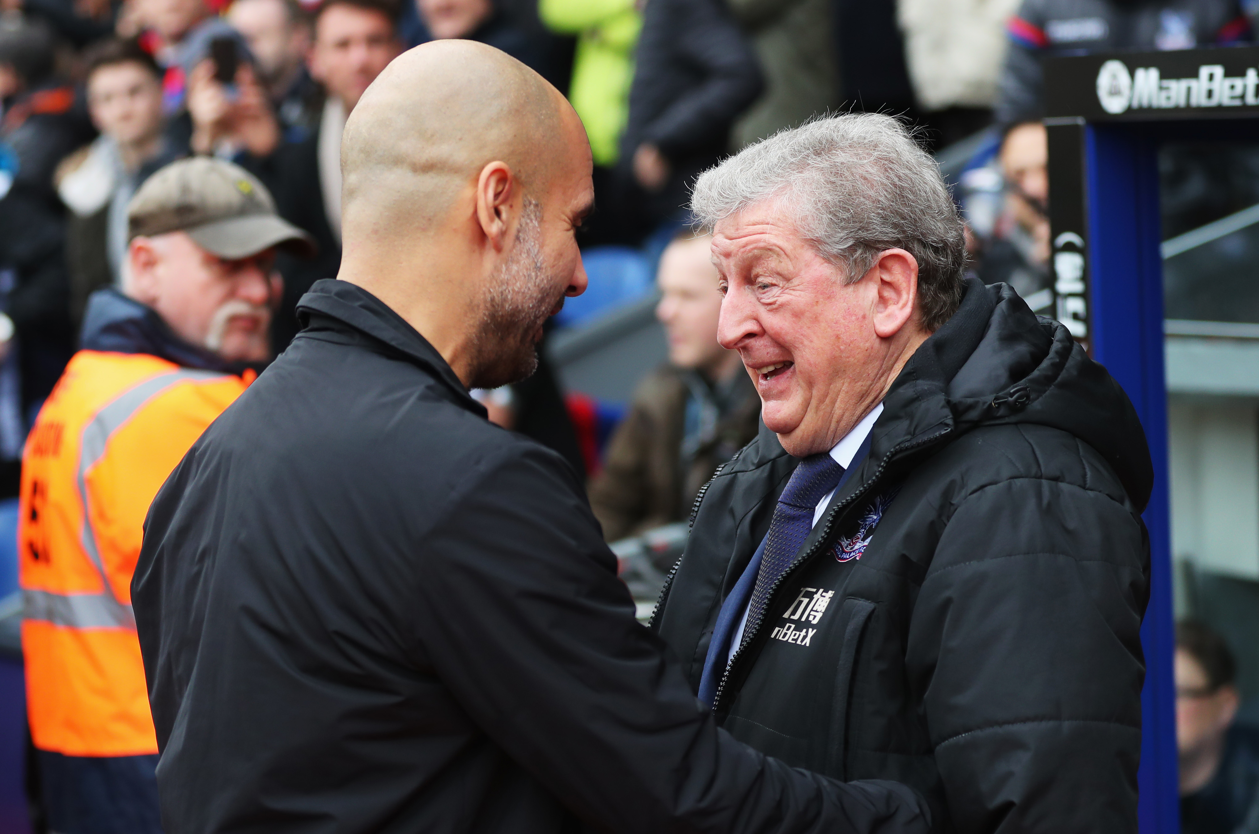 LONDON, ENGLAND - DECEMBER 31:  Josep Guardiola, Manager of Manchester City and Roy Hodgson, Manager of Crystal Palace in discussion prior to the Premier League match between Crystal Palace and Manchester City at Selhurst Park on December 31, 2017 in London, England.  (Photo by Catherine Ivill/Getty Images)