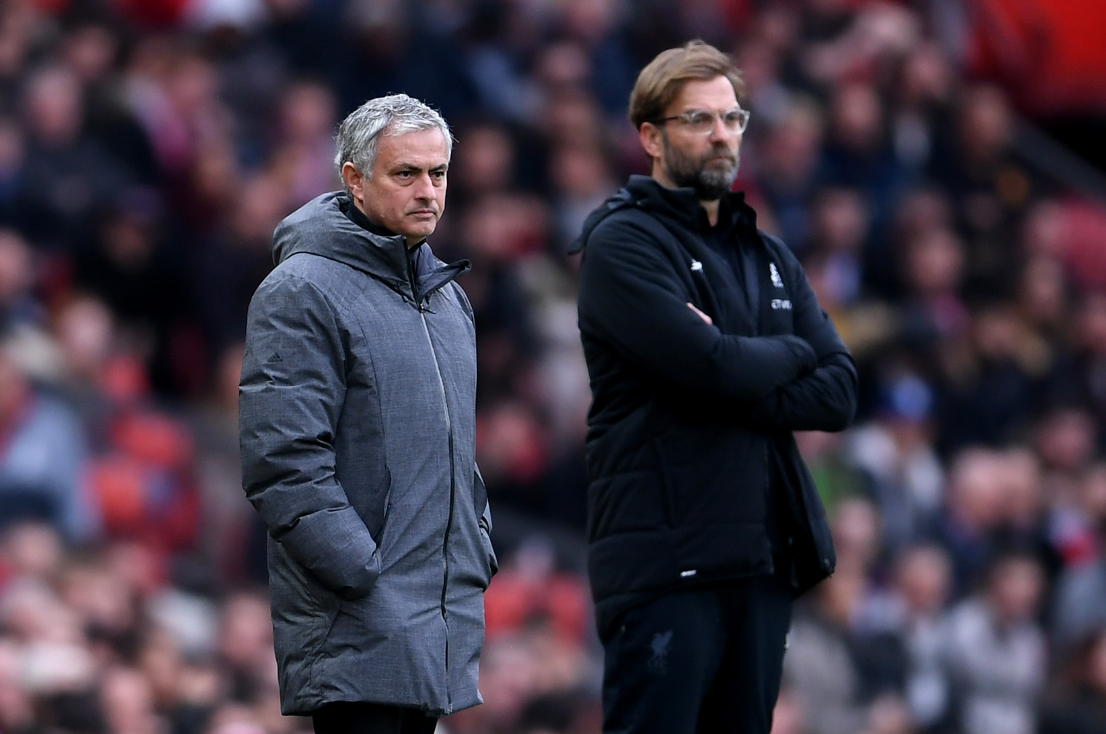 MANCHESTER, ENGLAND - MARCH 10:  Jose Mourinho, Manager of Manchester United and Jurgen Klopp, Manager of Liverpool look on during the Premier League match between Manchester United and Liverpool at Old Trafford on March 10, 2018 in Manchester, England.  (Photo by Laurence Griffiths/Getty Images)