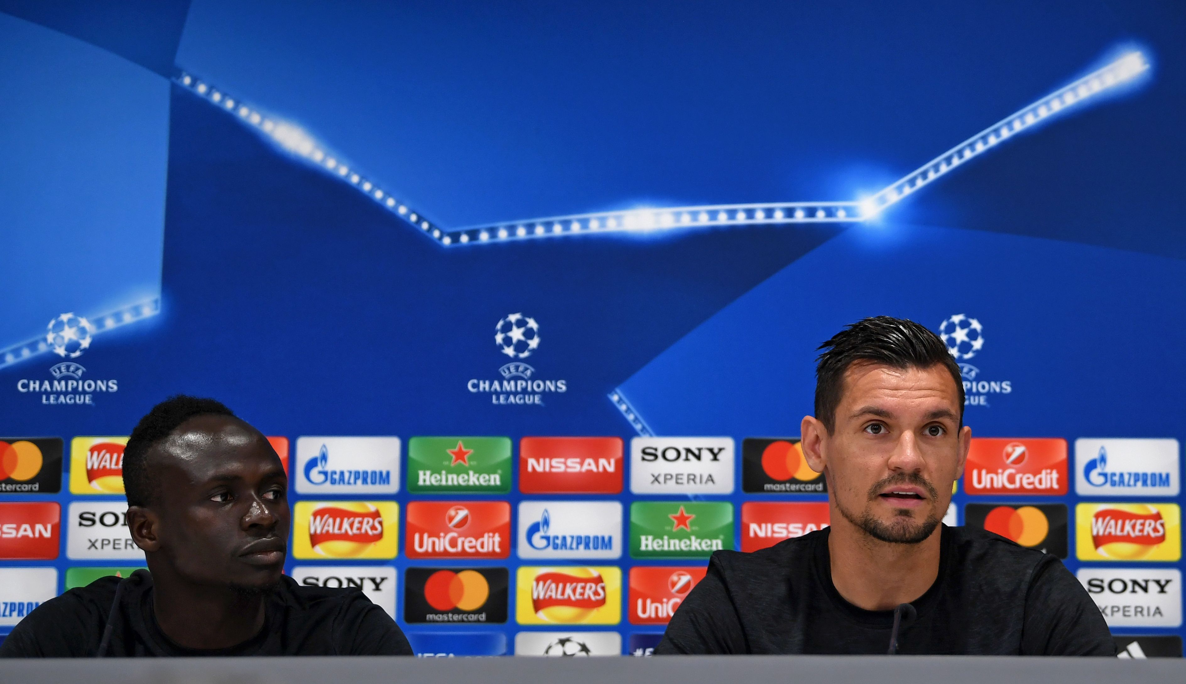 Liverpool's Senegalese midfielder Sadio Mane (L) and Liverpool's Croatian defender Dejan Lovren attends a press conference during a media day at Anfield stadium in Liverpool, north west England on May 21, 2018, ahead of their UEFA Champions League final football match against Real Madrid in Kiev on May 26. (Photo by Paul ELLIS / AFP)        (Photo credit should read PAUL ELLIS/AFP/Getty Images)
