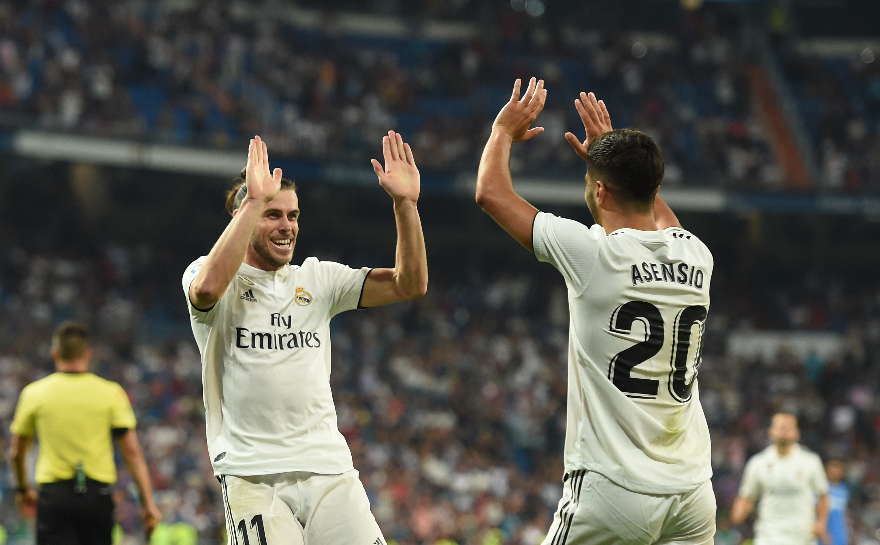MADRID, SPAIN - AUGUST 19: Gareth Bale of Real Madrid celebrates with Marco Asensio after scoring his teams second goal during the La Liga match between Real Madrid CF and Getafe CF at Estadio Santiago Bernabeu on August 19, 2018 in Madrid, Spain. (Photo by Denis Doyle/Getty Images)