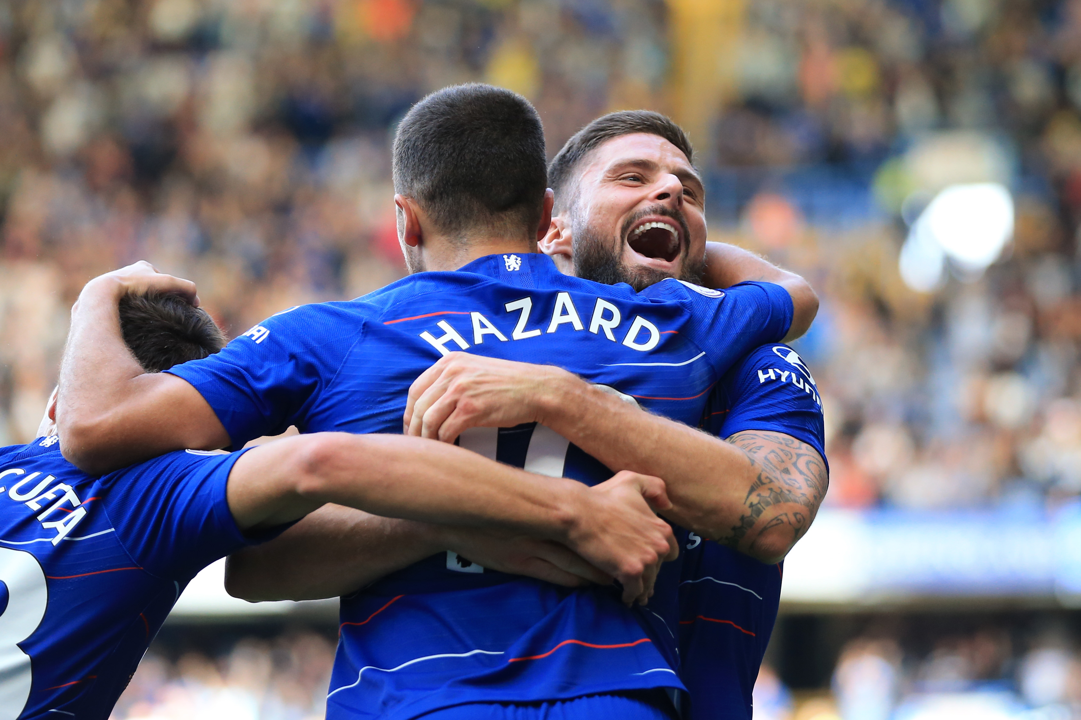 LONDON, ENGLAND - SEPTEMBER 15:  Eden Hazard of Chelsea celebrates with teammate Olivier Giroud after scoring his team's first goal during the Premier League match between Chelsea FC and Cardiff City at Stamford Bridge on September 15, 2018 in London, United Kingdom.  (Photo by Marc Atkins/Getty Images)