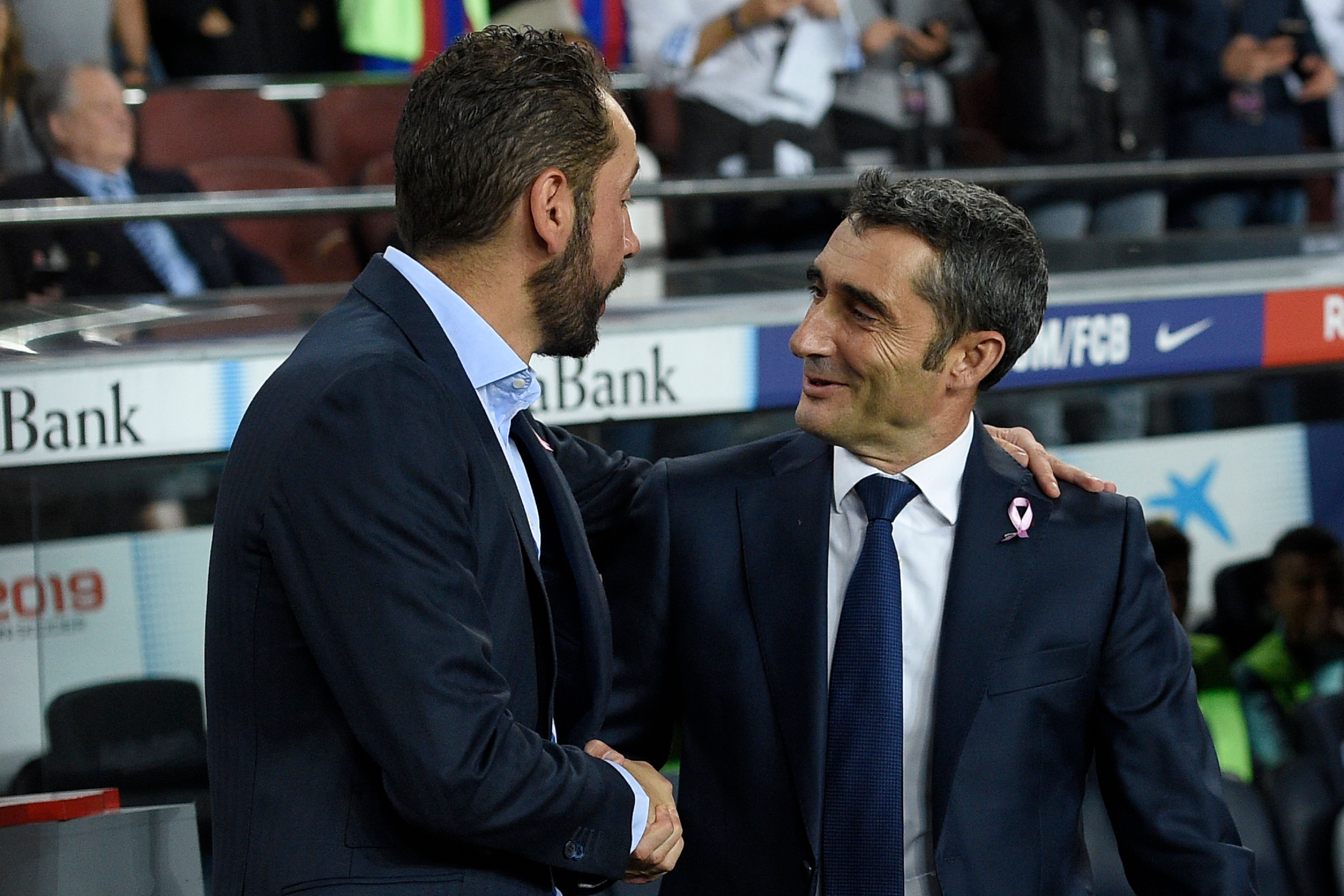Barcelona's Spanish coach Ernesto Valverde (R) shakes hands with Sevilla's Spanish coach Pablo Machin during the Spanish league football match FC Barcelona against Sevilla FC at the Camp Nou stadium in Barcelona on October 20, 2018. (Photo by LLUIS GENE / AFP)        (Photo credit should read LLUIS GENE/AFP/Getty Images)