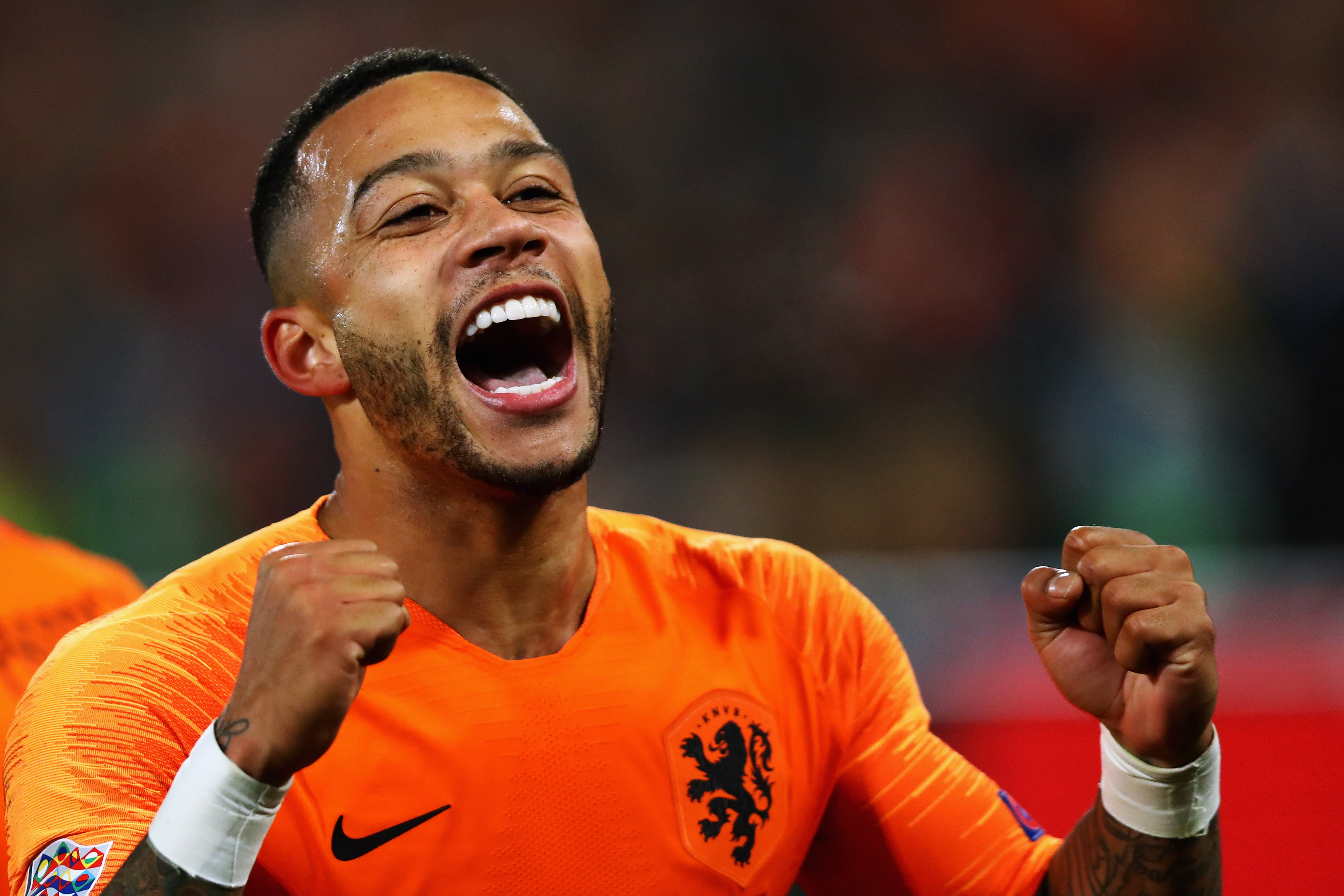 ROTTERDAM, NETHERLANDS - NOVEMBER 16:  Memphis Depay of the Netherlands celebrates scoring his teams second goal of the game during the UEFA Nations League A group one match between Netherlands and France at De Kuip on November 16, 2018 in Amsterdam, Netherlands.  (Photo by Dean Mouhtaropoulos/Getty Images)