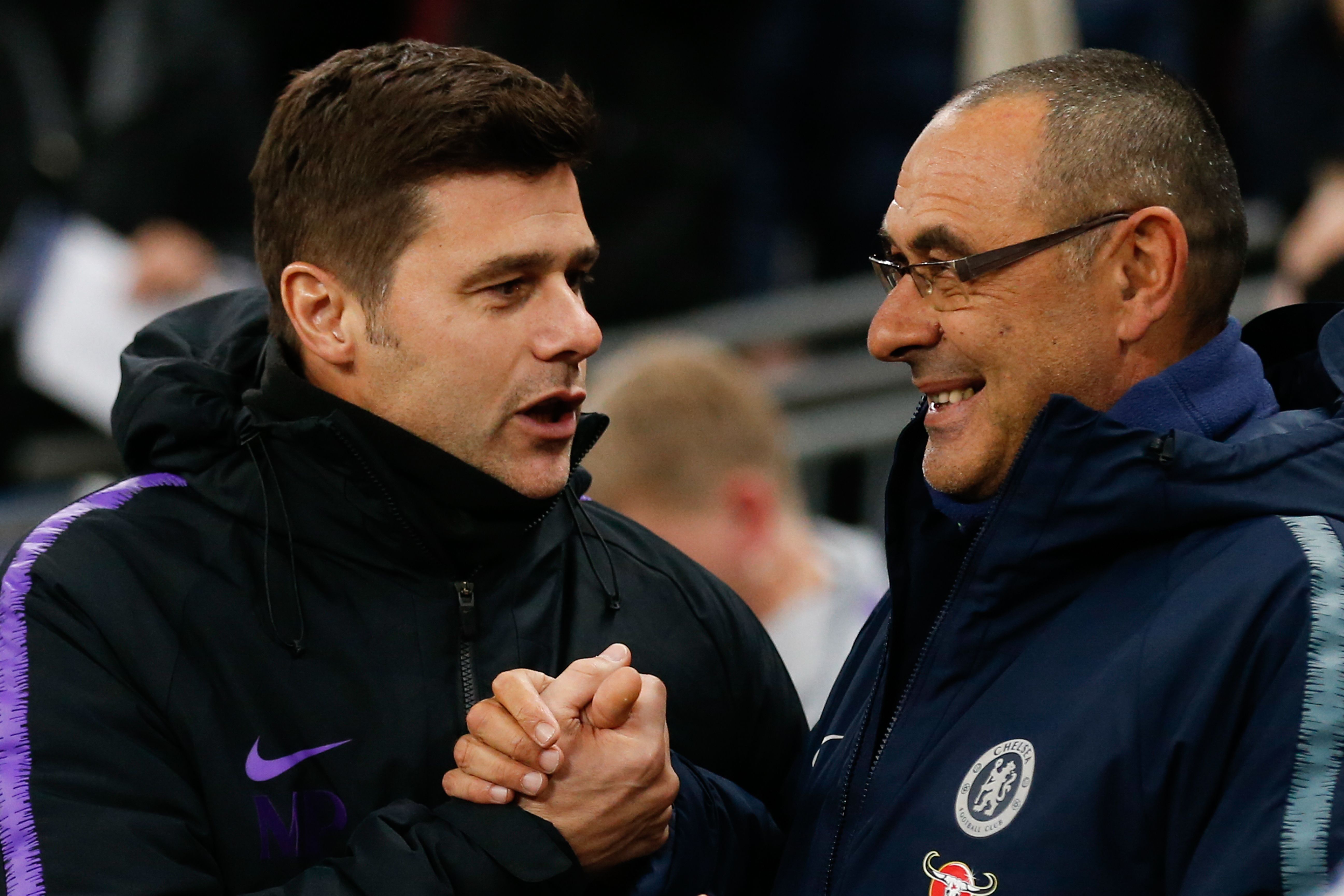 Chelsea's Italian head coach Maurizio Sarri (R) greets Tottenham Hotspur's Argentinian head coach Mauricio Pochettino (L) before the English Premier League football match between Tottenham Hotspur and Chelsea at Wembley Stadium in London, on November 24, 2018. (Photo by Ian KINGTON / IKIMAGES / AFP) / RESTRICTED TO EDITORIAL USE. No use with unauthorized audio, video, data, fixture lists, club/league logos or 'live' services. Online in-match use limited to 45 images, no video emulation. No use in betting, games or single club/league/player publications.        (Photo credit should read IAN KINGTON/AFP/Getty Images)