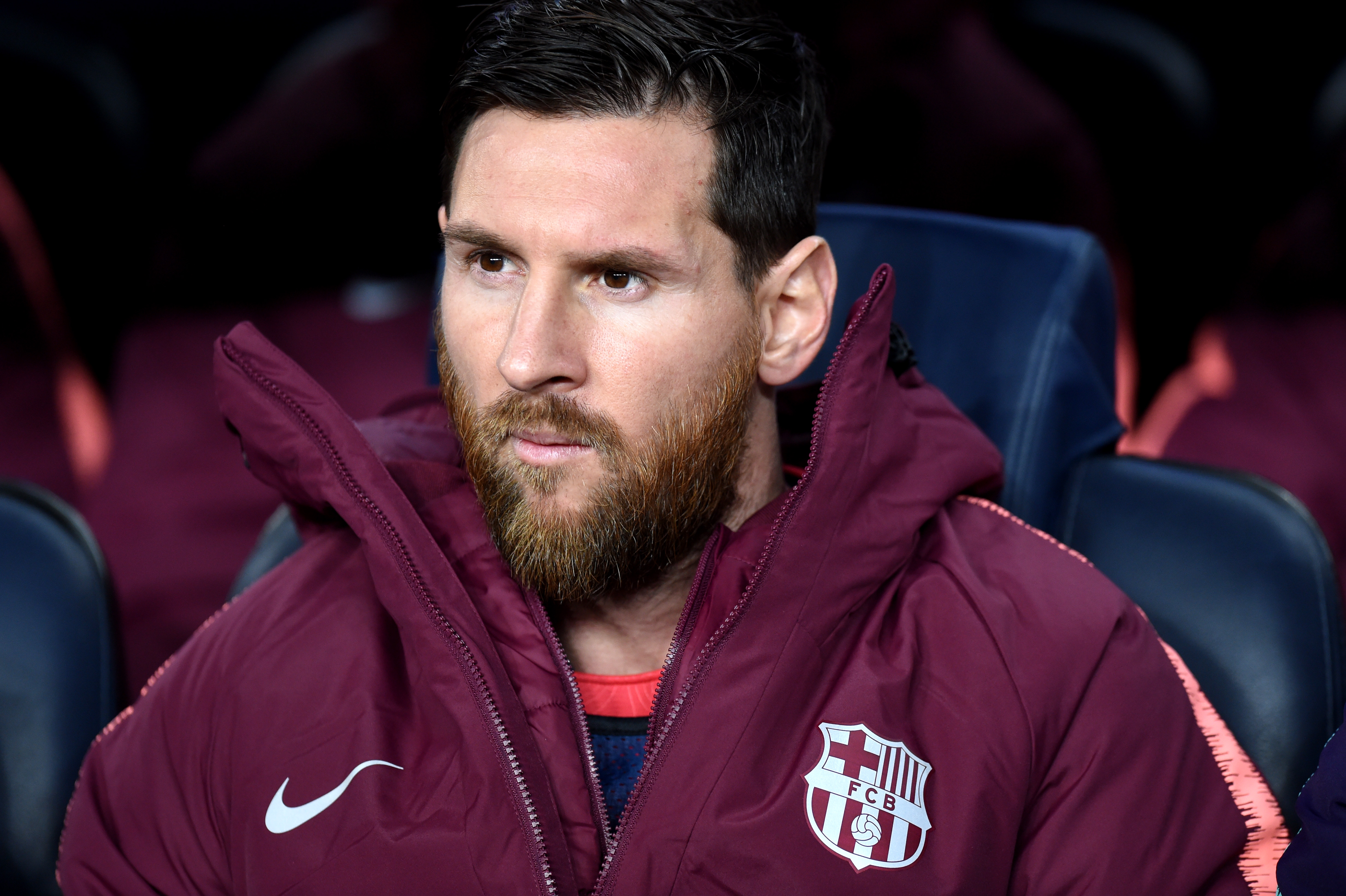BARCELONA, SPAIN - DECEMBER 11:  Lionel Messi of Barcelona sits on the bench prior to the UEFA Champions League Group B match between FC Barcelona and Tottenham Hotspur at Camp Nou on December 11, 2018 in Barcelona, Spain.  (Photo by Alex Caparros/Getty Images)
