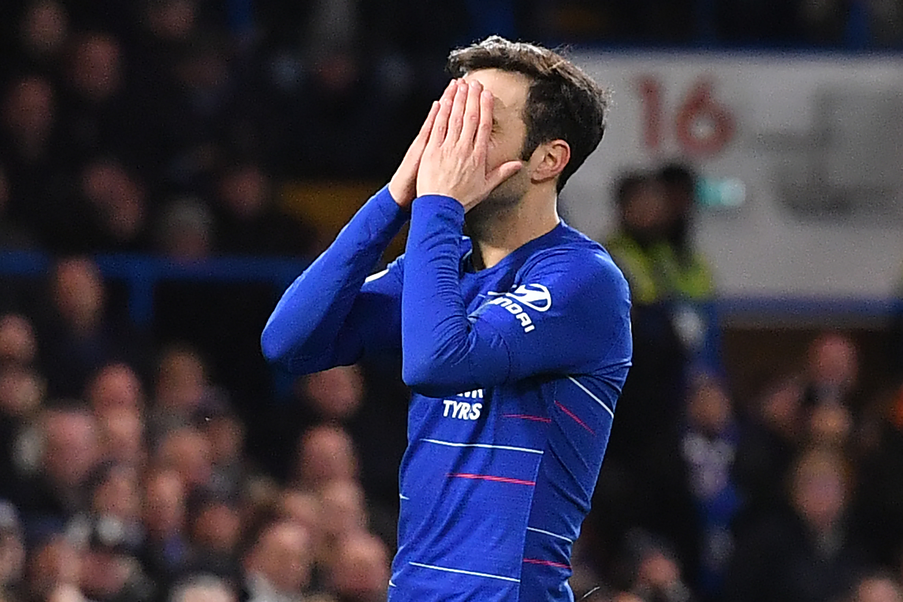 Chelsea's Spanish midfielder Cesc Fabregas reacts after missing a chance during the English Premier League football match between Chelsea and Southampton at Stamford Bridge in London on January 2, 2019. (Photo by Ben STANSALL / AFP) / RESTRICTED TO EDITORIAL USE. No use with unauthorized audio, video, data, fixture lists, club/league logos or 'live' services. Online in-match use limited to 120 images. An additional 40 images may be used in extra time. No video emulation. Social media in-match use limited to 120 images. An additional 40 images may be used in extra time. No use in betting publications, games or single club/league/player publications. /         (Photo credit should read BEN STANSALL/AFP/Getty Images)