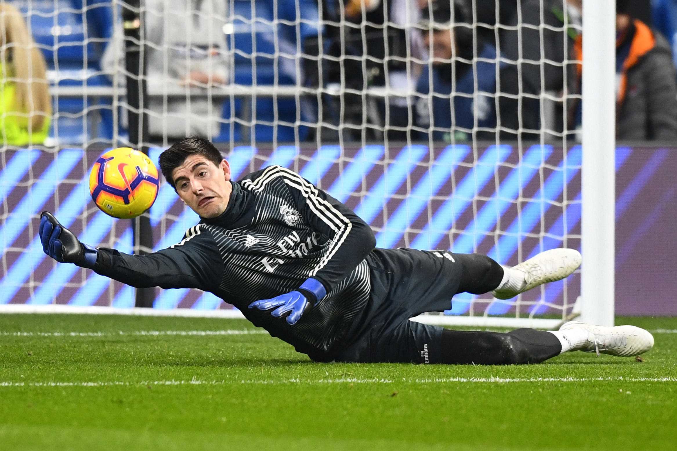 Real Madrid's Belgian goalkeeper Thibaut Courtois warms up before the Spanish League football match between Real Madrid CF and Real Sociedad at the Santiago Bernabeu stadium in Madrid on January 6, 2019. (Photo by GABRIEL BOUYS / AFP)        (Photo credit should read GABRIEL BOUYS/AFP/Getty Images)