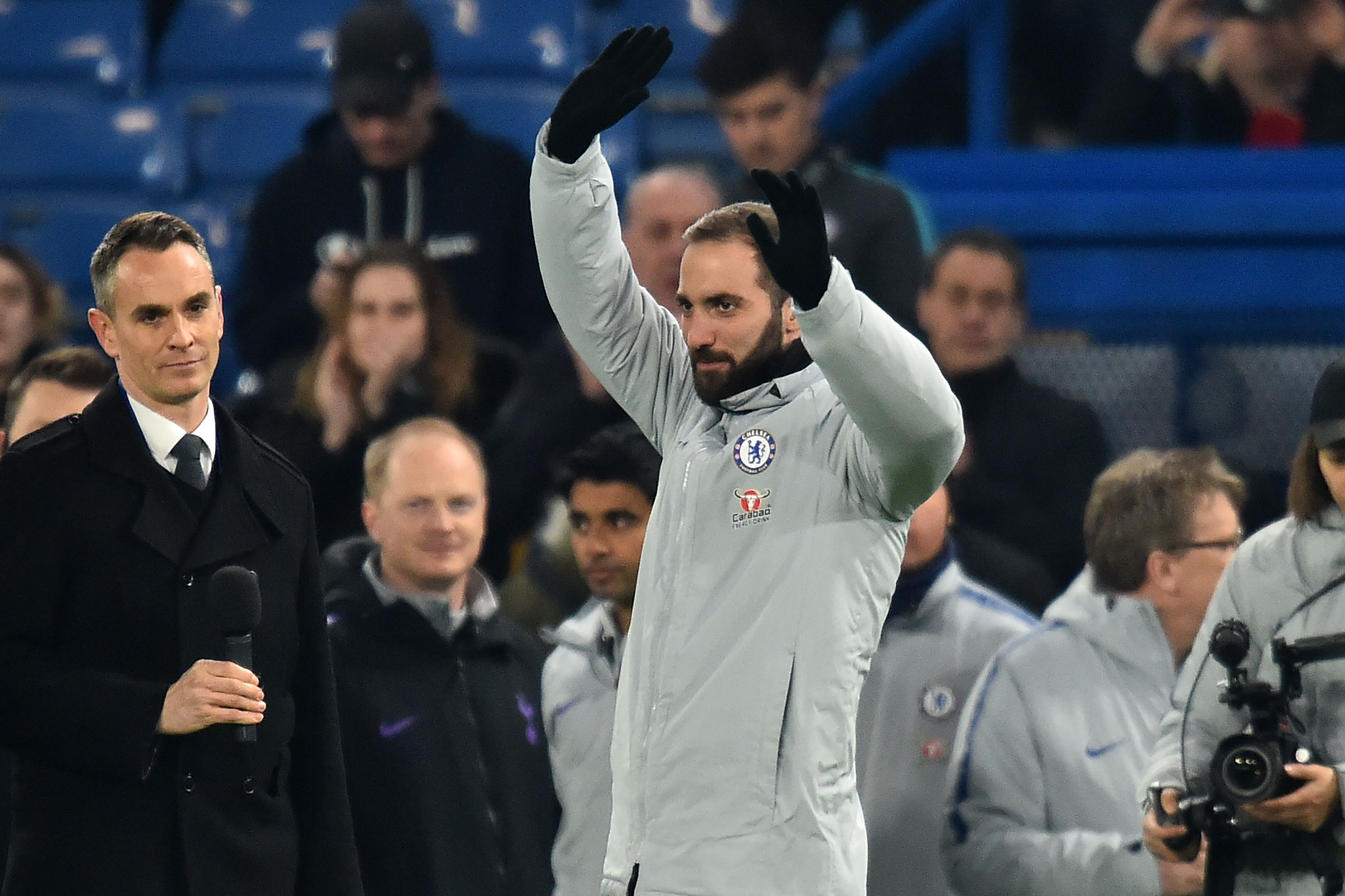 Chelsea's new signing Argentinian striker Gonzalo Higuain is introduced to the crowd ahead of the English League Cup semi-final second-leg football match between Chelsea and Tottenham Hotspur at Stamford Bridge in London on January 24, 2019. (Photo by Glyn KIRK / AFP) / RESTRICTED TO EDITORIAL USE. No use with unauthorized audio, video, data, fixture lists, club/league logos or 'live' services. Online in-match use limited to 120 images. An additional 40 images may be used in extra time. No video emulation. Social media in-match use limited to 120 images. An additional 40 images may be used in extra time. No use in betting publications, games or single club/league/player publications. /         (Photo credit should read GLYN KIRK/AFP/Getty Images)