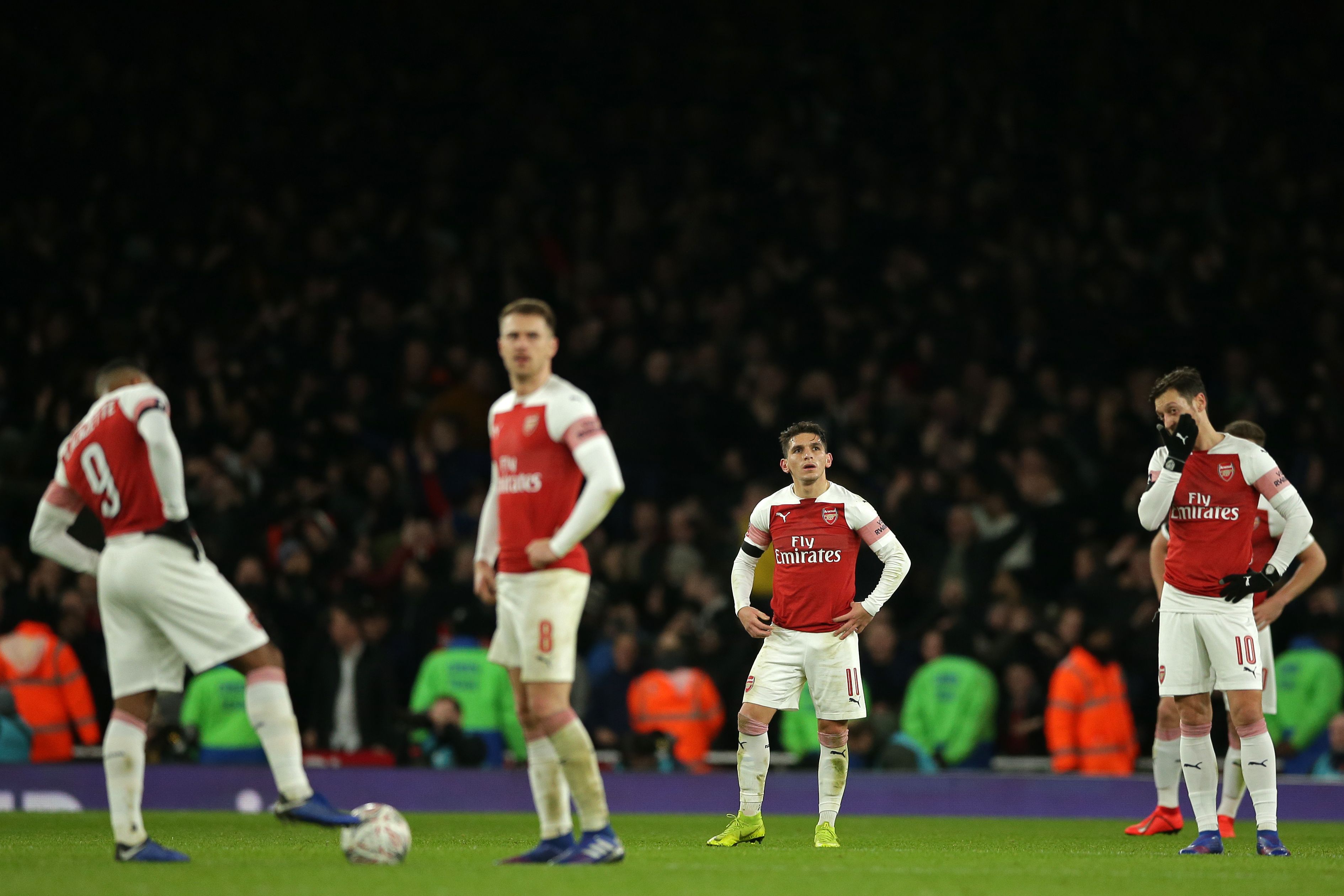 Arsenal players reacts as they wait to kick off after going 3-1 behind during the English FA Cup fourth round football match between Arsenal and Manchester United at the Emirates Stadium in London on January 25, 2019. - Manchester United won the game 3-1. (Photo by Daniel LEAL-OLIVAS / AFP) / RESTRICTED TO EDITORIAL USE. No use with unauthorized audio, video, data, fixture lists, club/league logos or 'live' services. Online in-match use limited to 120 images. An additional 40 images may be used in extra time. No video emulation. Social media in-match use limited to 120 images. An additional 40 images may be used in extra time. No use in betting publications, games or single club/league/player publications. /         (Photo credit should read DANIEL LEAL-OLIVAS/AFP/Getty Images)