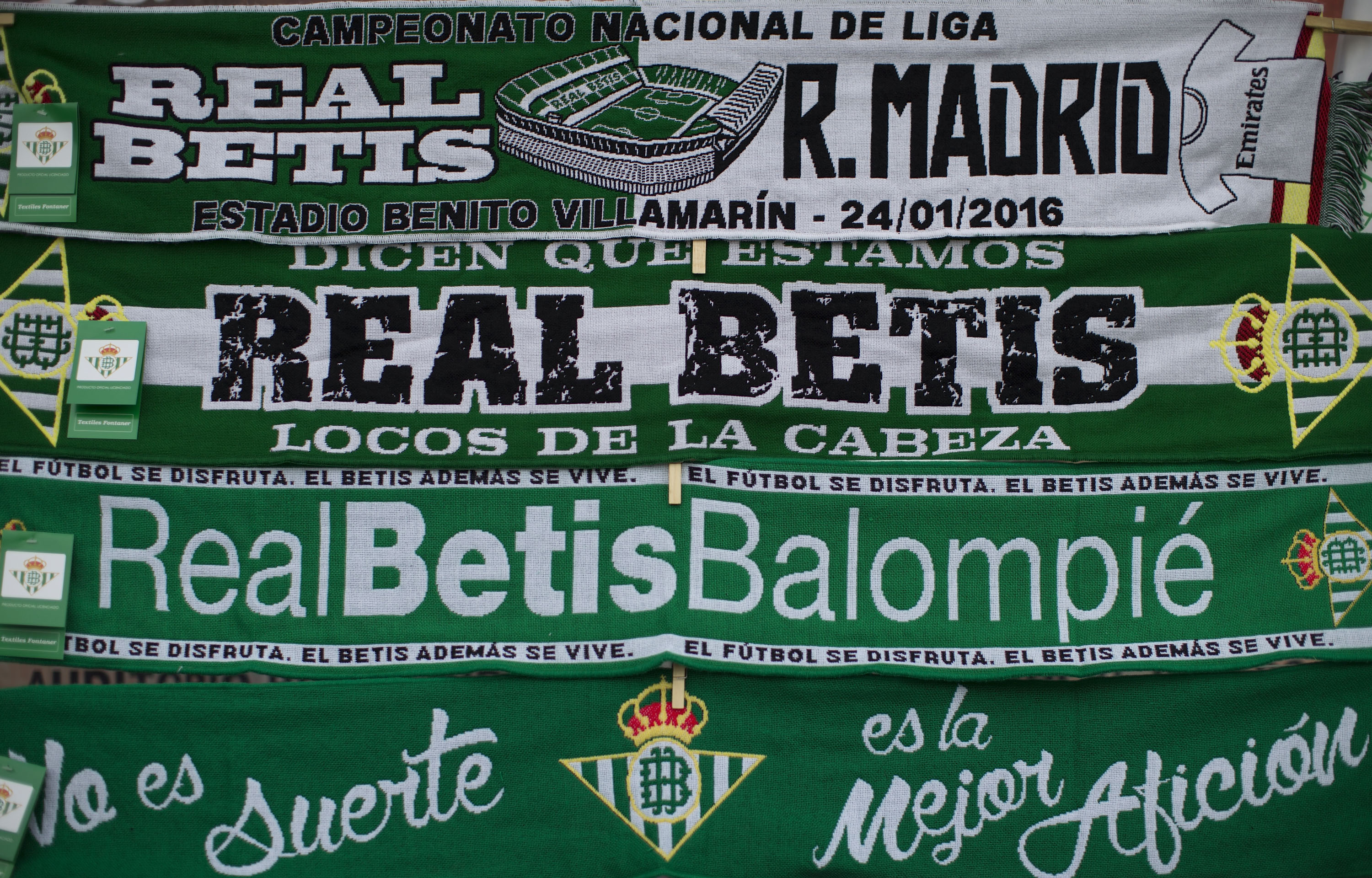 SEVILLE, SPAIN - JANUARY 24:  The match' scarf is displayed at a merchandaising stall at Estadio Benito Villamarin outdoors before the La Liga match between Real Betis Balompie and Real Madrid CF at on January 24, 2016 in Seville, Spain.  (Photo by Gonzalo Arroyo Moreno/Getty Images)