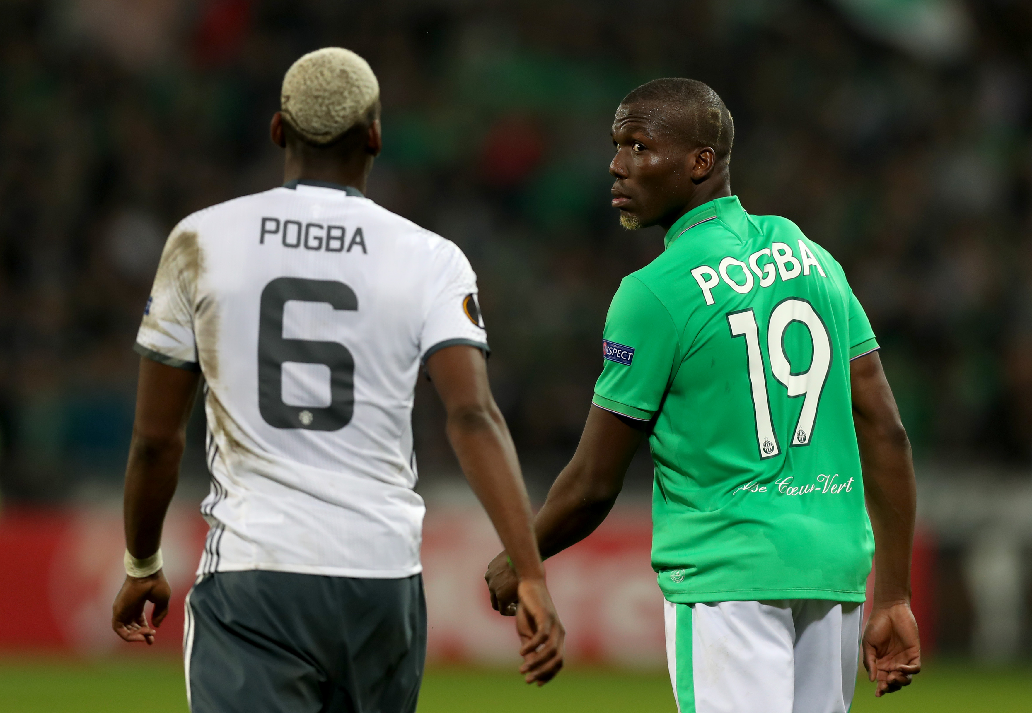 SAINT-ETIENNE, FRANCE - FEBRUARY 22:  Florentin Pogba of Saint-Etienne walks on the pitch next to his brother Paul Pogba of Manchester United during the UEFA Europa League Round of 32 second leg match between AS Saint-Etienne and Manchester United at Stade Geoffroy-Guichard on February 22, 2017 in Saint-Etienne, France.  (Photo by Christopher Lee/Getty Images)