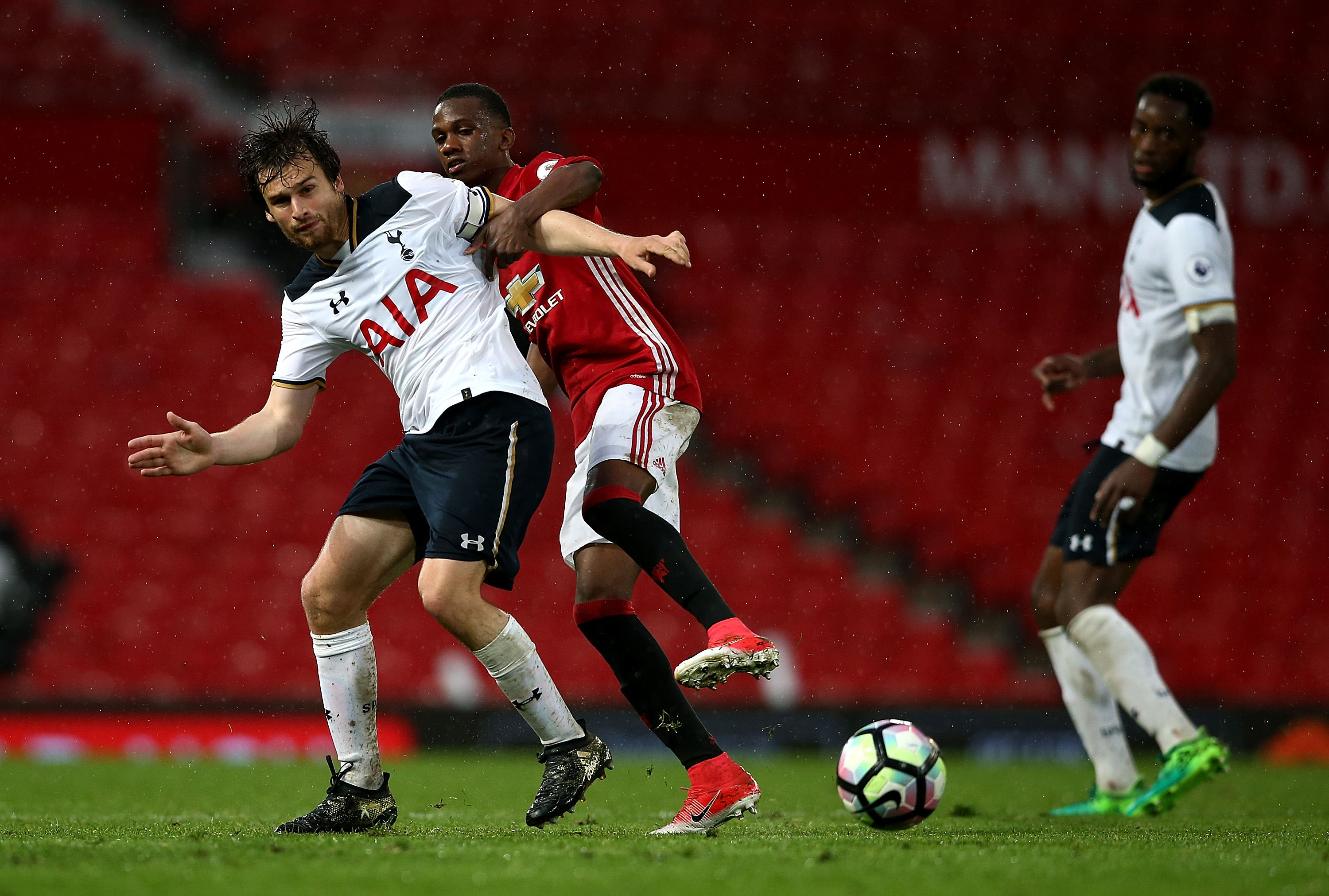 MANCHESTER, ENGLAND - MAY 15:  Filip Lesniak of Tottenham Hotspur battles with Joshua Bohui of Manchester United during the Premier League 2 match between Manchester United and Tottenham Hotspur at Old Trafford on May 15, 2017 in Manchester, England.  (Photo by Jan Kruger/Getty Images)