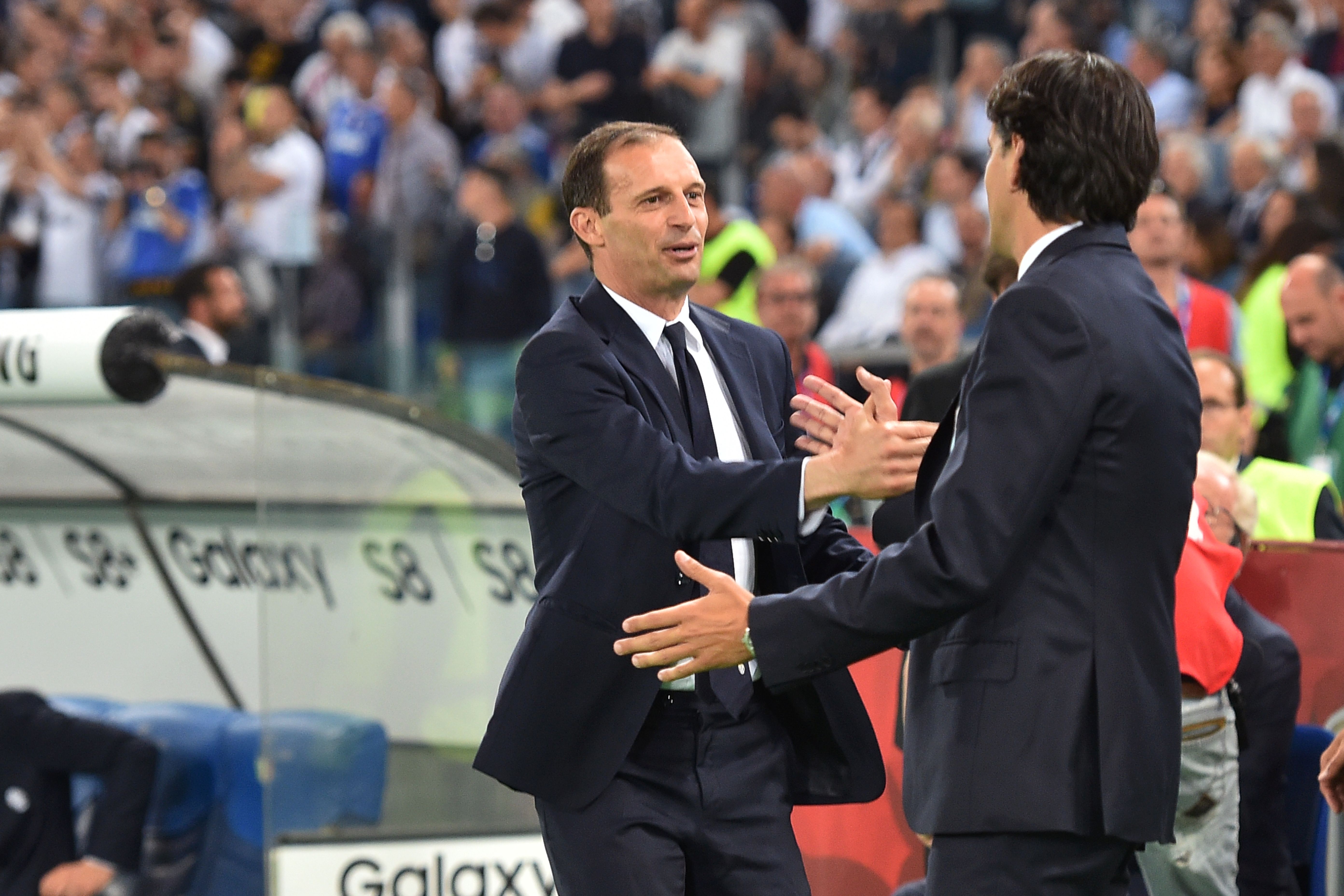 Lazio's coach from Italy Simone Inzaghi (R) greets Juventus' coach from Italy Massimiliano Allegri before the Italian Tim Cup final on May 17, 2017 at the Olympic stadium in Rome.  / AFP PHOTO / Andreas SOLARO        (Photo credit should read ANDREAS SOLARO/AFP/Getty Images)