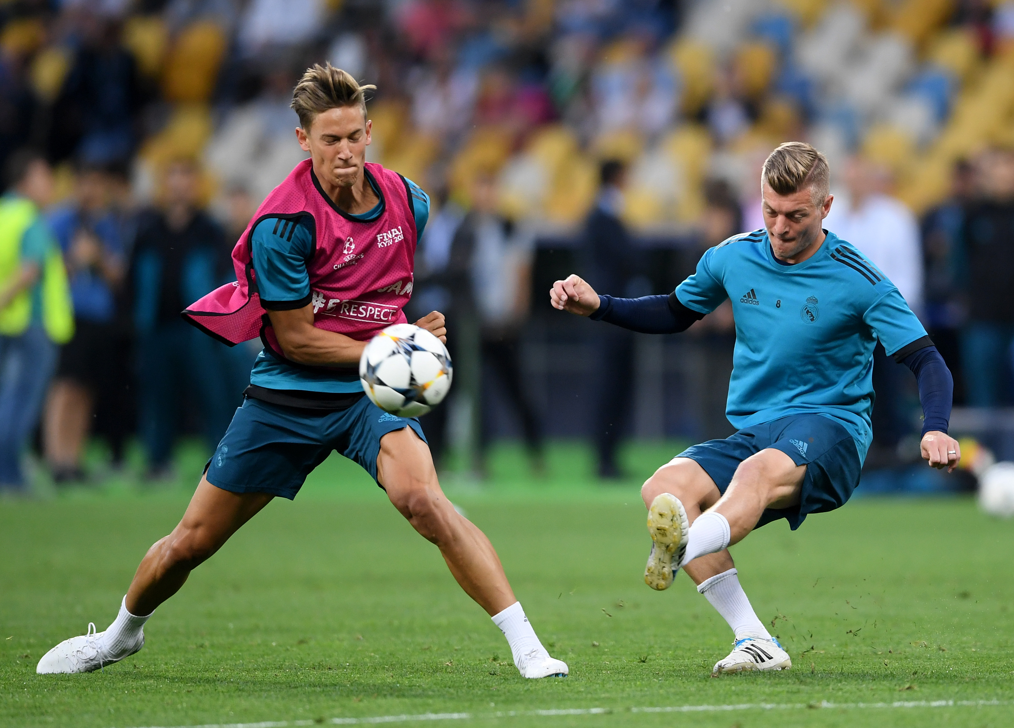 KIEV, UKRAINE - MAY 25:  Toni Kroos of Real Madrid is blocked by team mate Marcos Llorente during a Real Madrid training session ahead of the UEFA Champions League Final against Liverpool at NSC Olimpiyskiy Stadium on May 25, 2018 in Kiev, Ukraine.  (Photo by Laurence Griffiths/Getty Images)