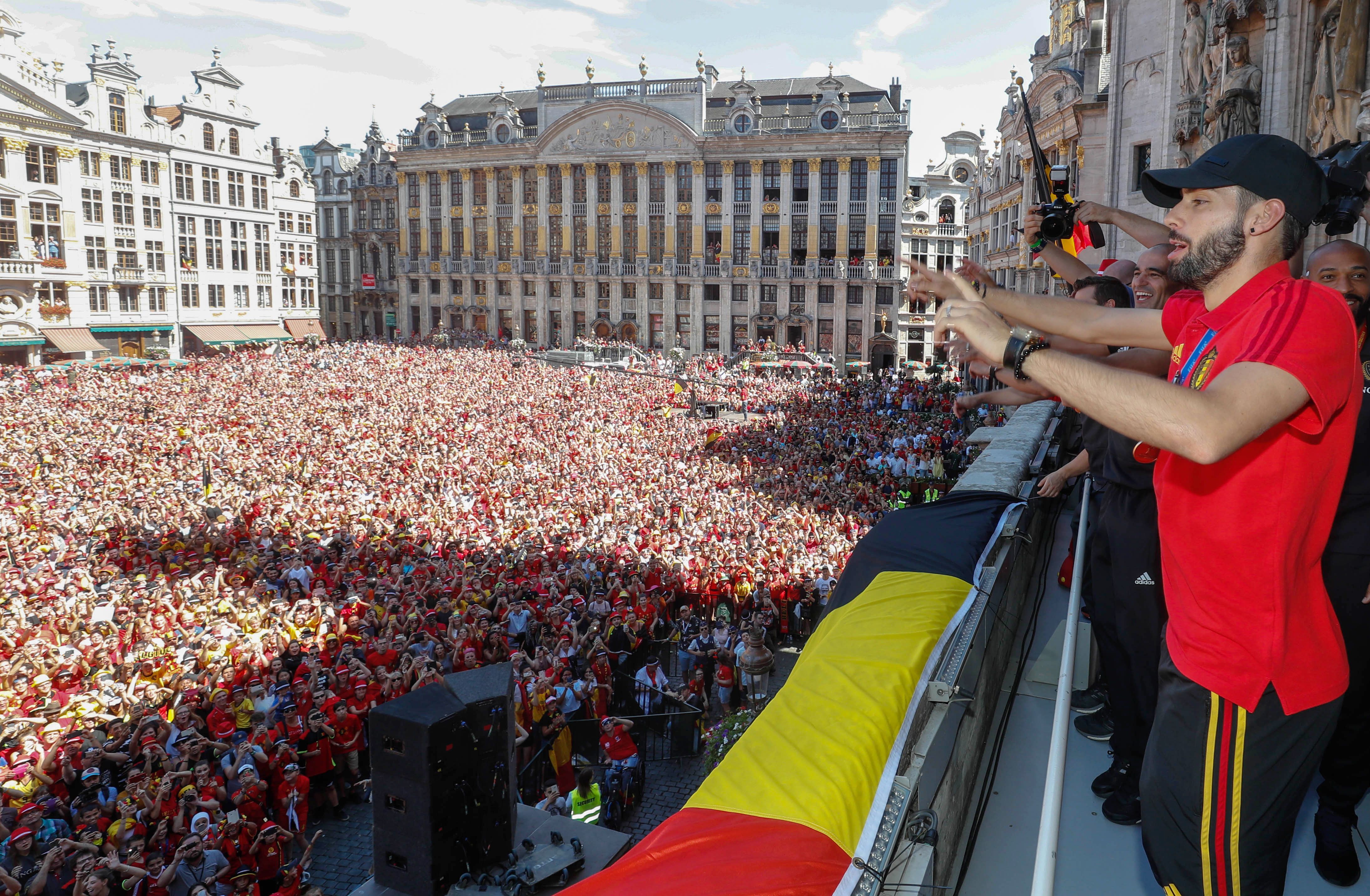 Belgium's Yannick Carrasco celebrates at the balcony in front of more than 8000 supporters at the Grand-Place, Grote Markt in Brussels city center, as Belgian national football team Red Devils arrive to celebrate with supporters at the balcony of the city hall after reaching the semi-finals and winning the bronze medal at the Russia 2018 World Cup, on July 15, 2018. (Photo by Yves HERMAN / BELGA / AFP) / Belgium OUT        (Photo credit should read YVES HERMAN/AFP/Getty Images)