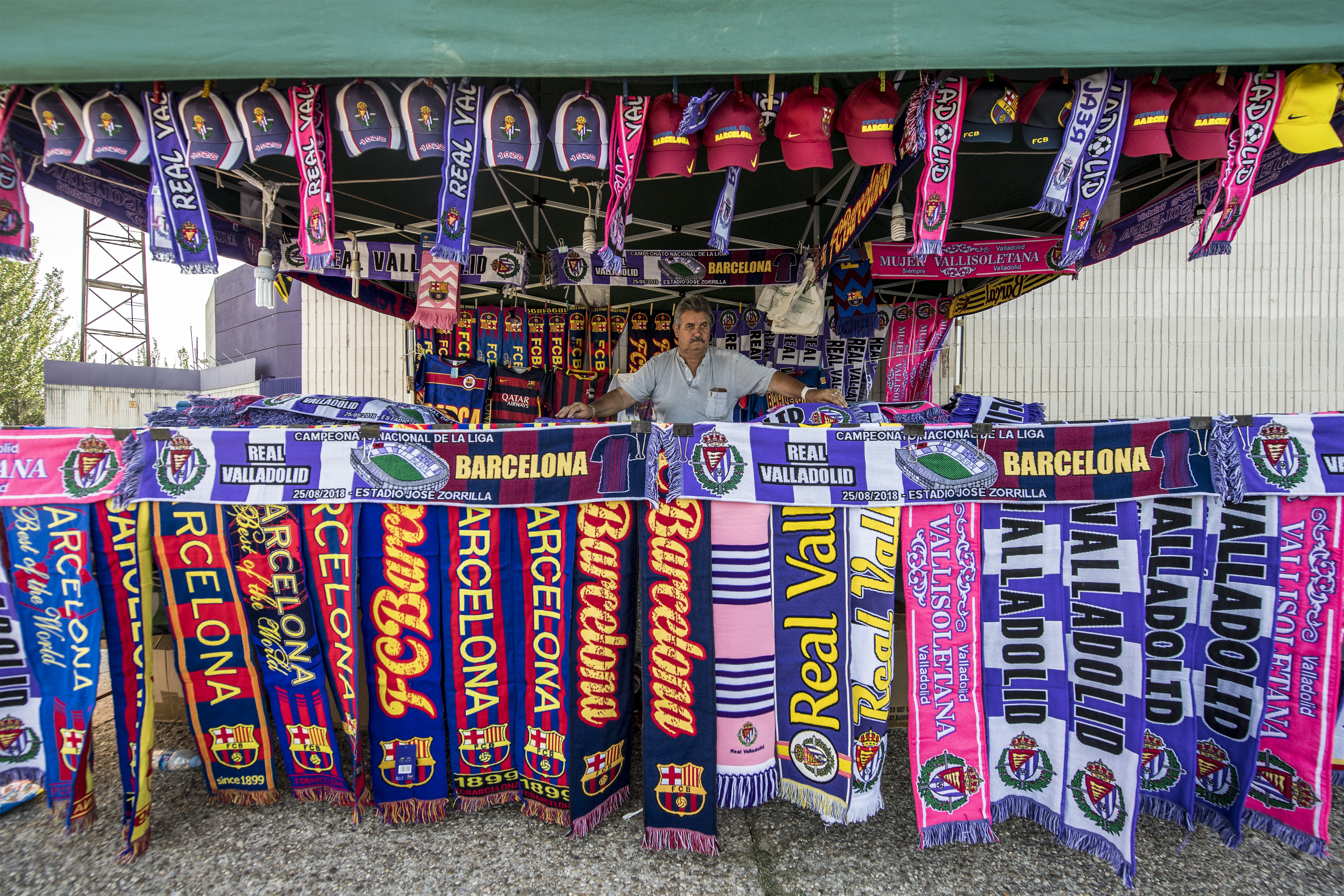 VALLADOLID, SPAIN - AUGUST 25: A scarf salesman outside the stadium prior the La Liga match between Real Valladolid CF and FC Barcelona at Jose Zorrilla on August 25, 2018 in Valladolid, Spain. (Photo by Octavio Passos/Getty Images)