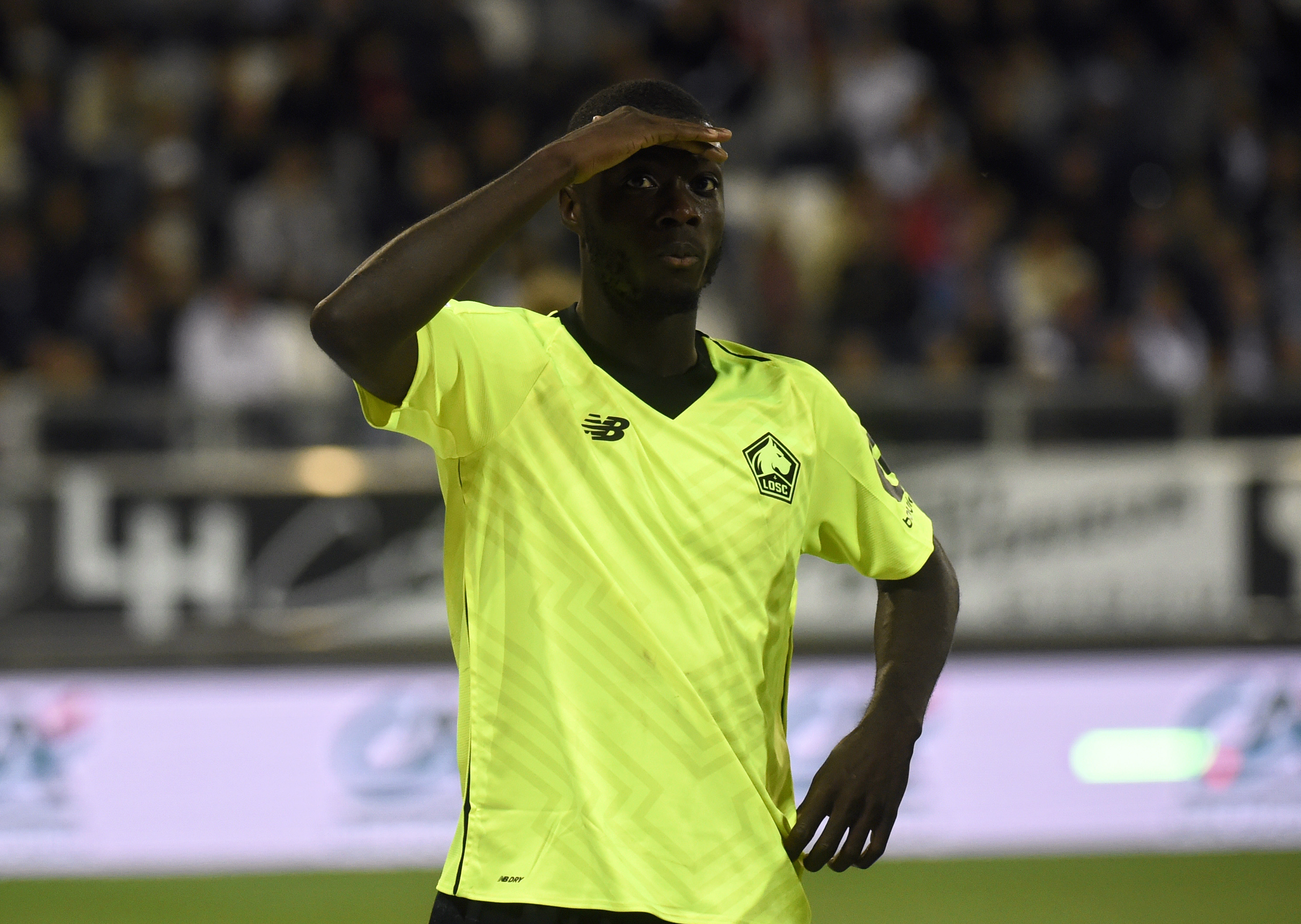 Lille's Ivorian forward Nicolas Pepe celebrates after scoring a goal during the French L1 football match between Amiens and Lille at the Licorne stadium in Amiens, northern France, on August 26, 2018. (Photo by FRANCOIS LO PRESTI / AFP)        (Photo credit should read FRANCOIS LO PRESTI/AFP/Getty Images)