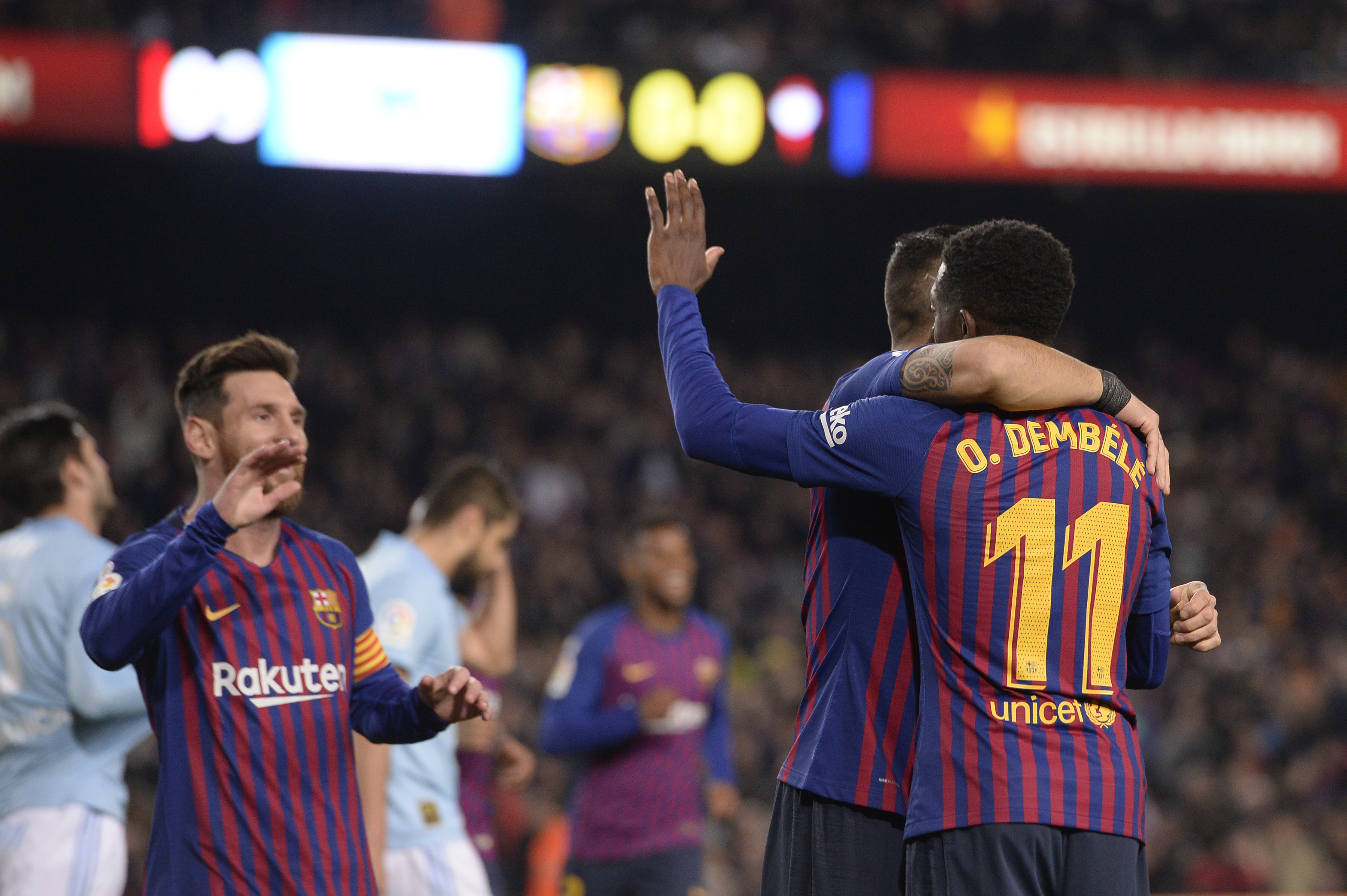 Barcelona's French forward Ousmane Dembele (R) celebrates scoring the opening goal with Barcelona's Argentinian forward Lionel Messi during the Spanish League football match between FC Barcelona and RC Celta de Vigo at the Camp Nou stadium in Barcelona on Decemeber 22, 2018. (Photo by Josep LAGO / AFP)        (Photo credit should read JOSEP LAGO/AFP/Getty Images)